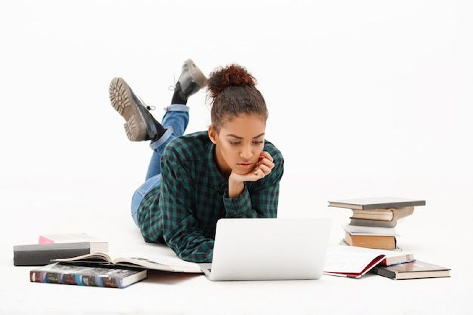 student lying on the floor studying for TOK