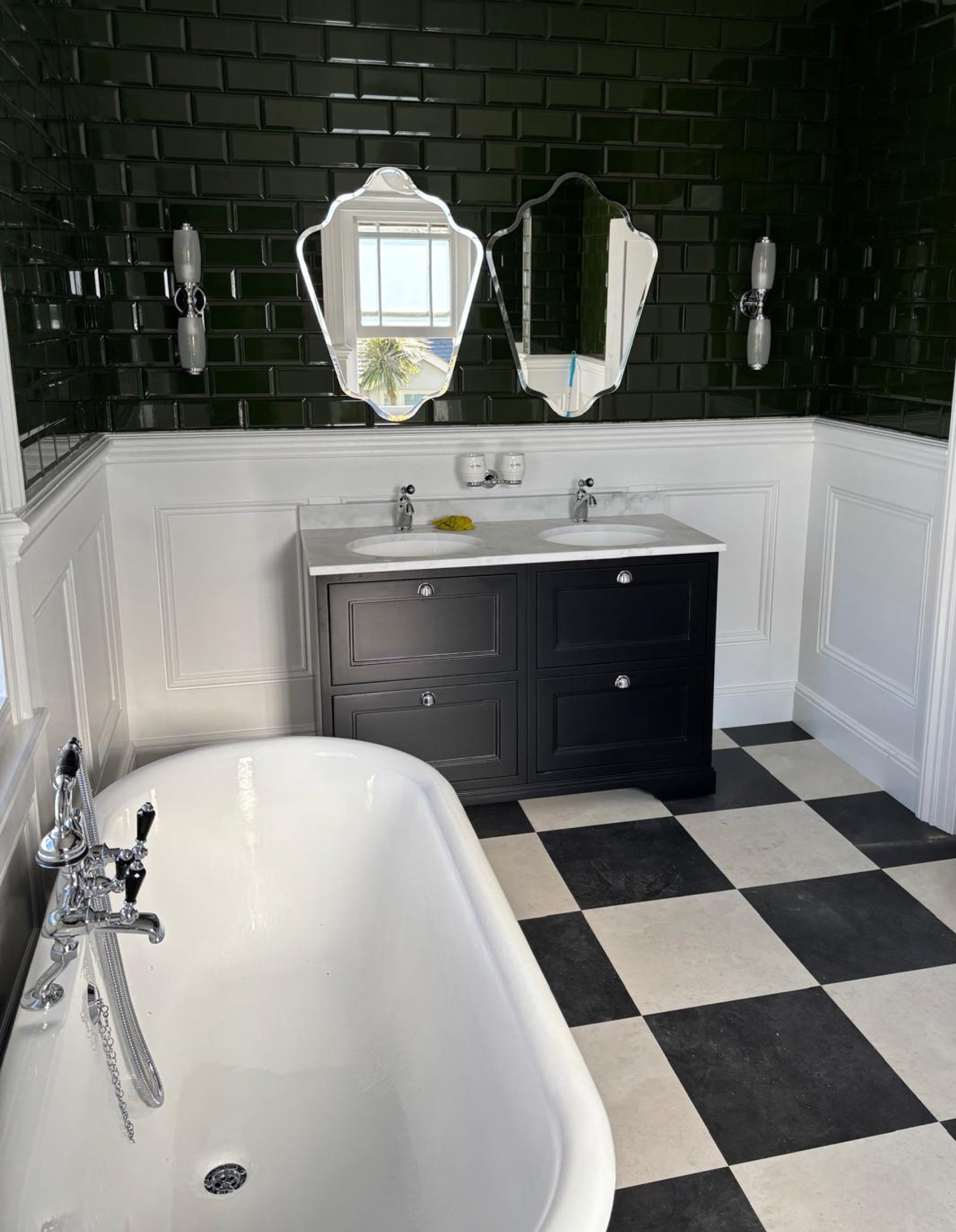 Traditional bathroom with clawfoot tub and checkerboard floor
