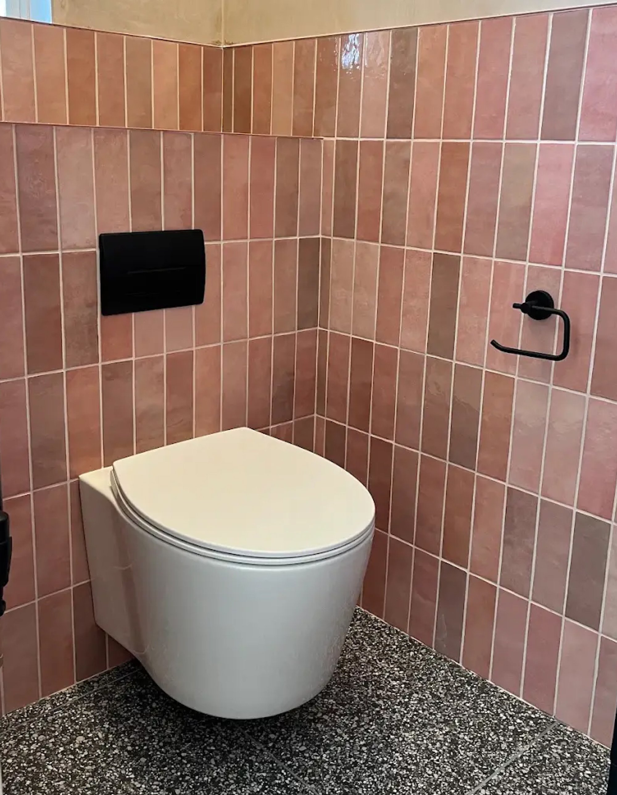 Pink tiled cloakroom