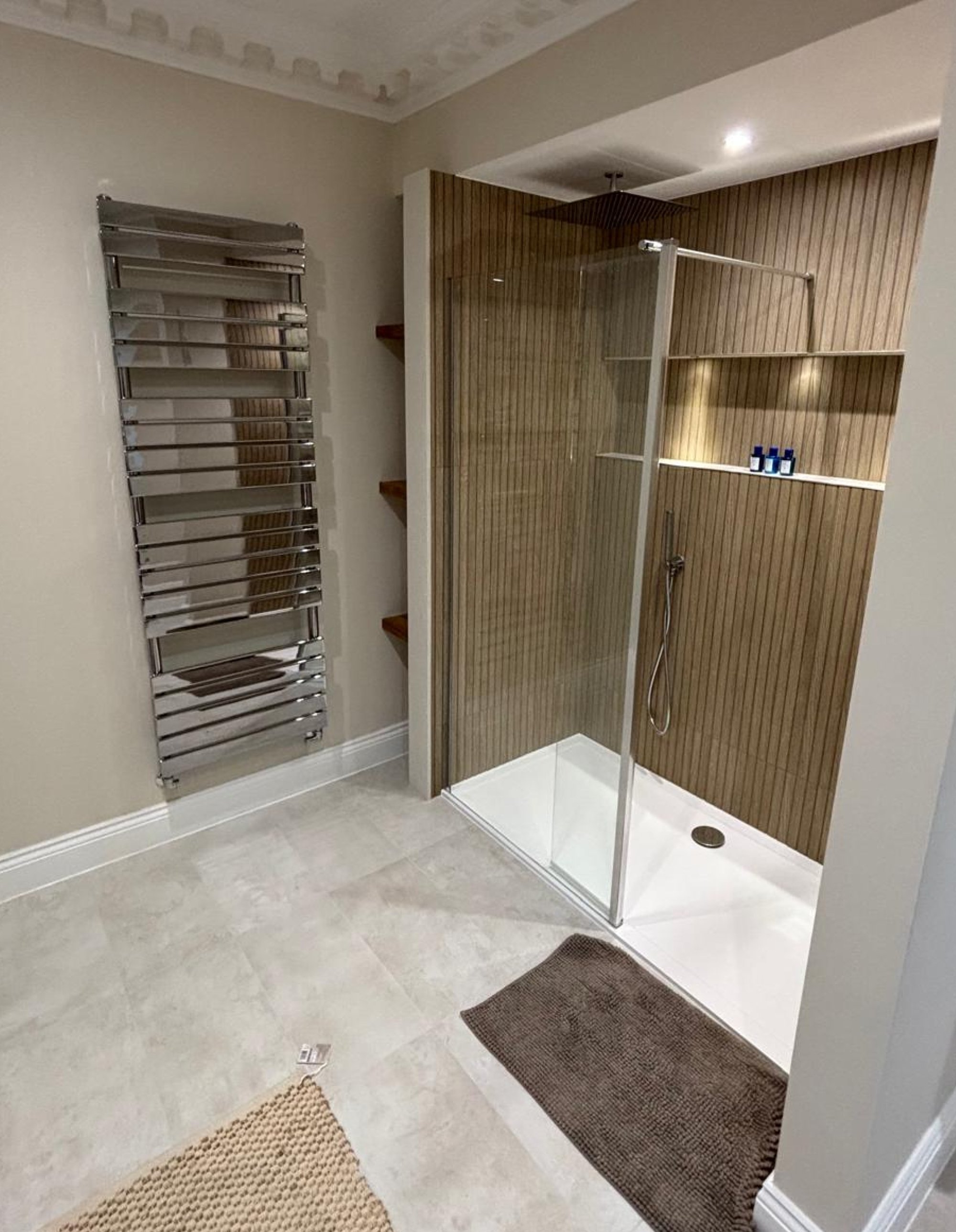 Wood slat walk-in shower with glass screen