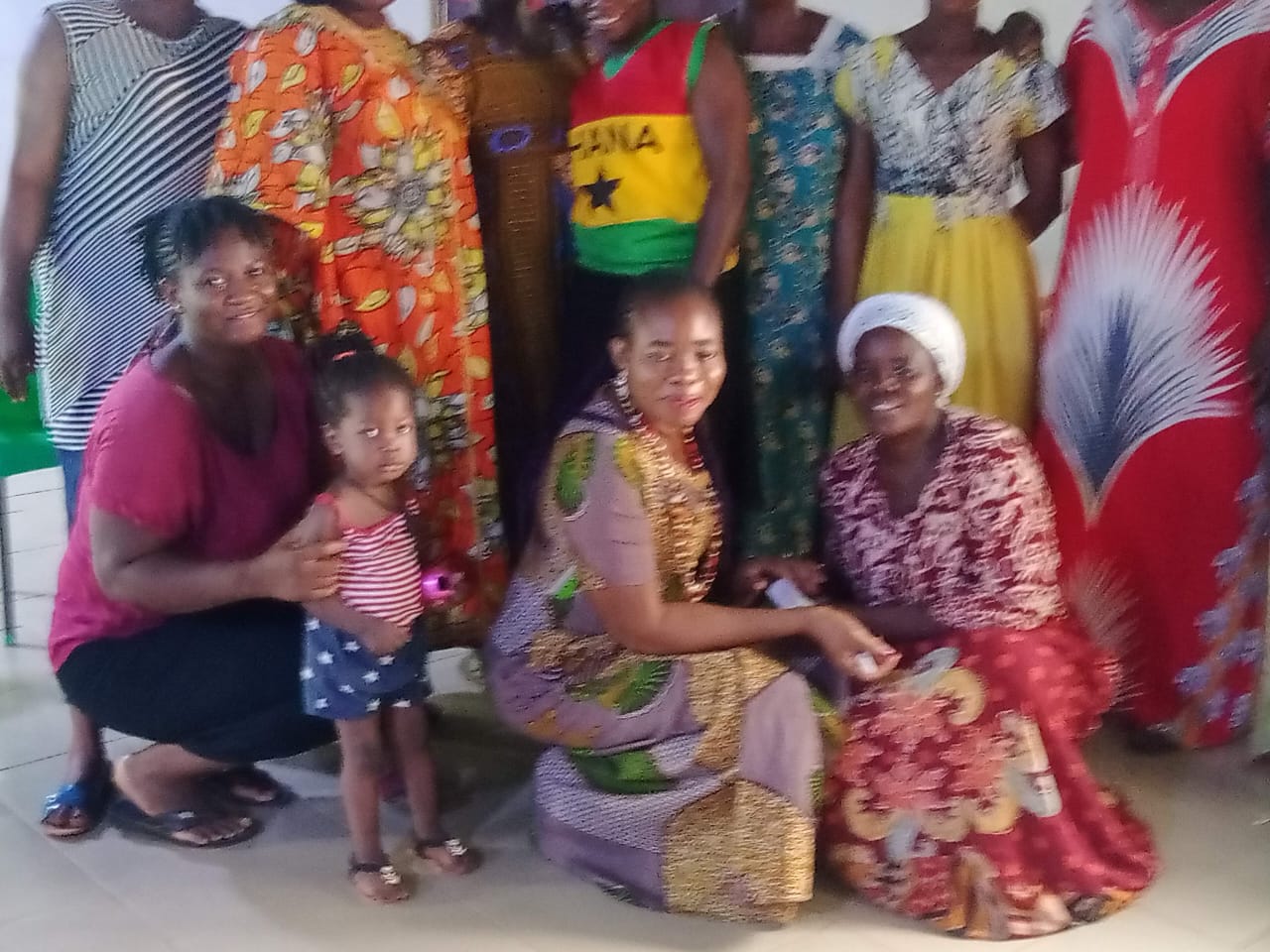 A group of women and children outside after a session