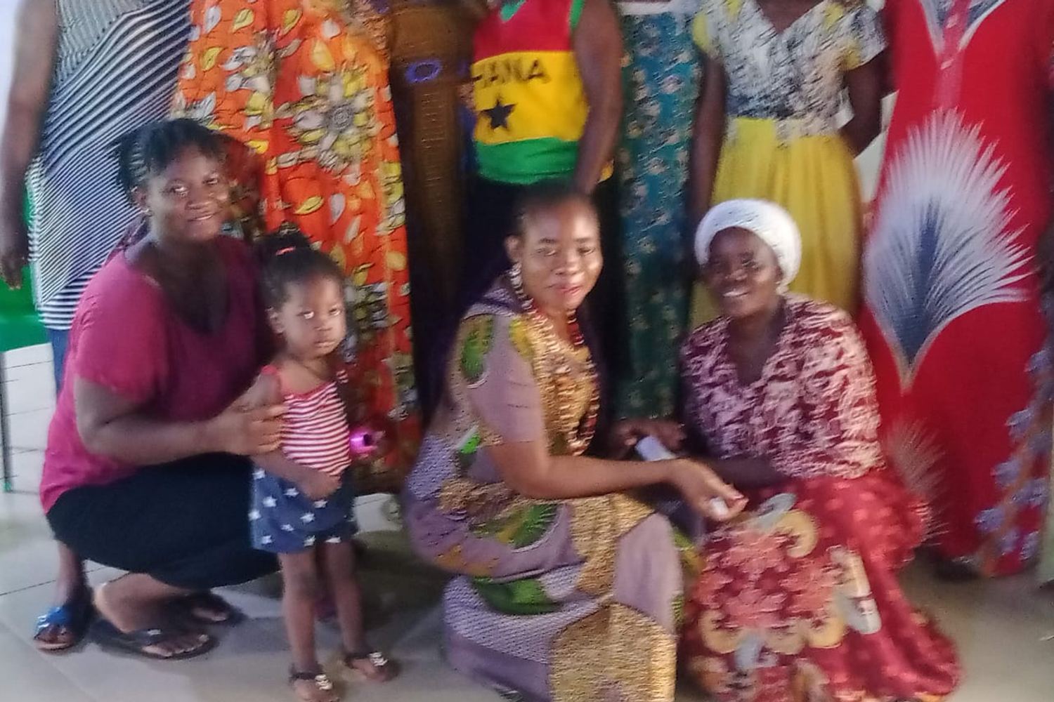 A group of women and children outside after a session