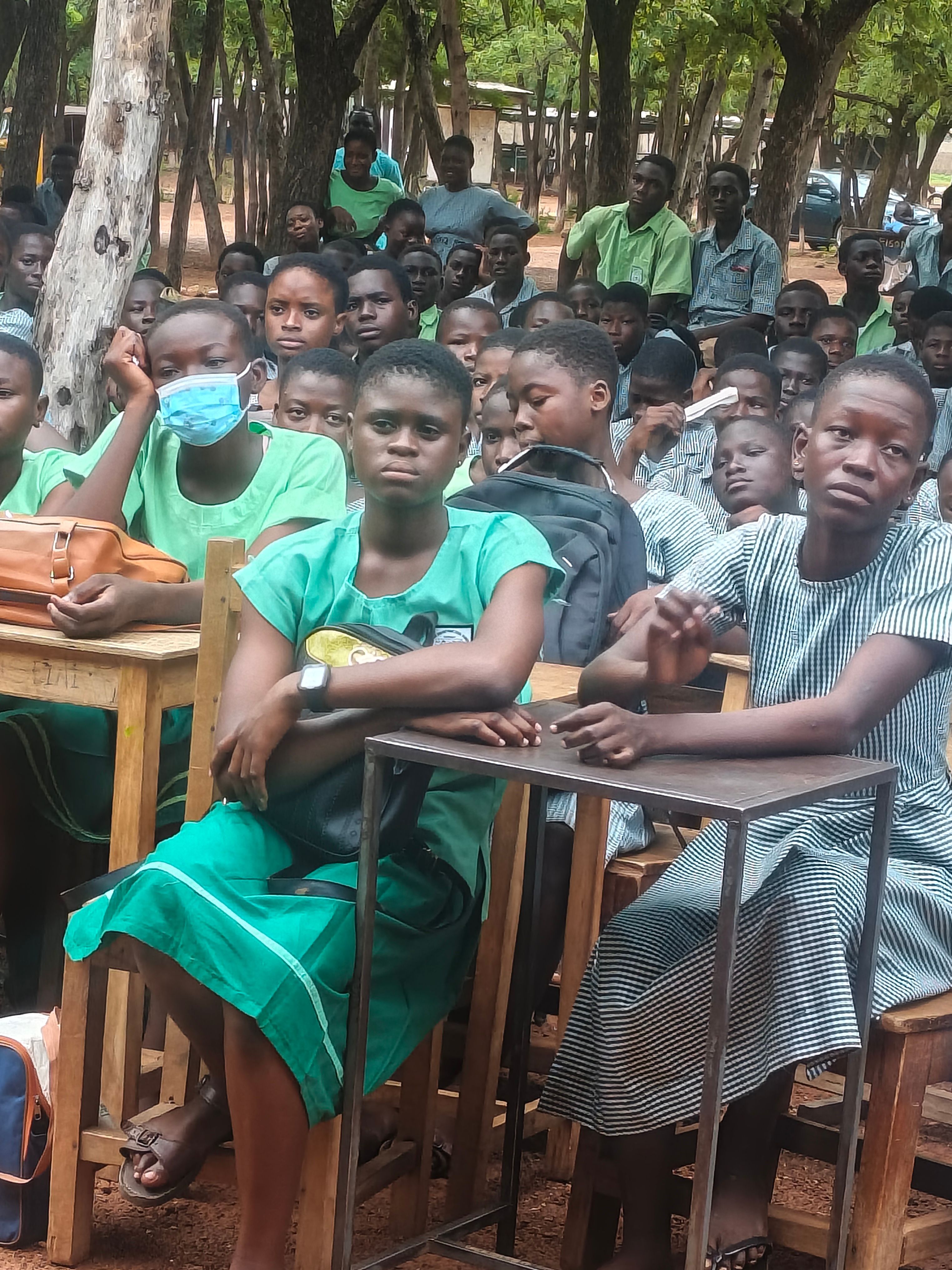 Pupils in school uniform seated at their desks