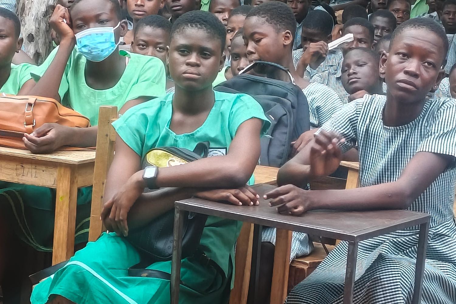 Pupils in school uniform seated at their desks