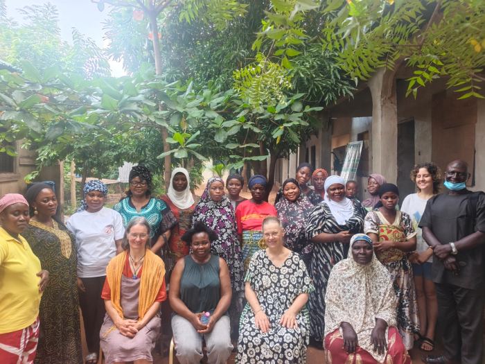 Members of the women’s groups seated with visiting partners
