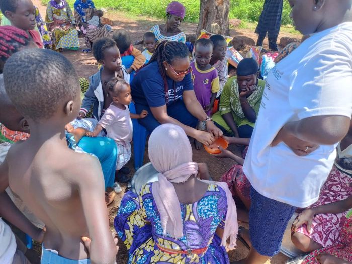 Food being handed out to children in a community