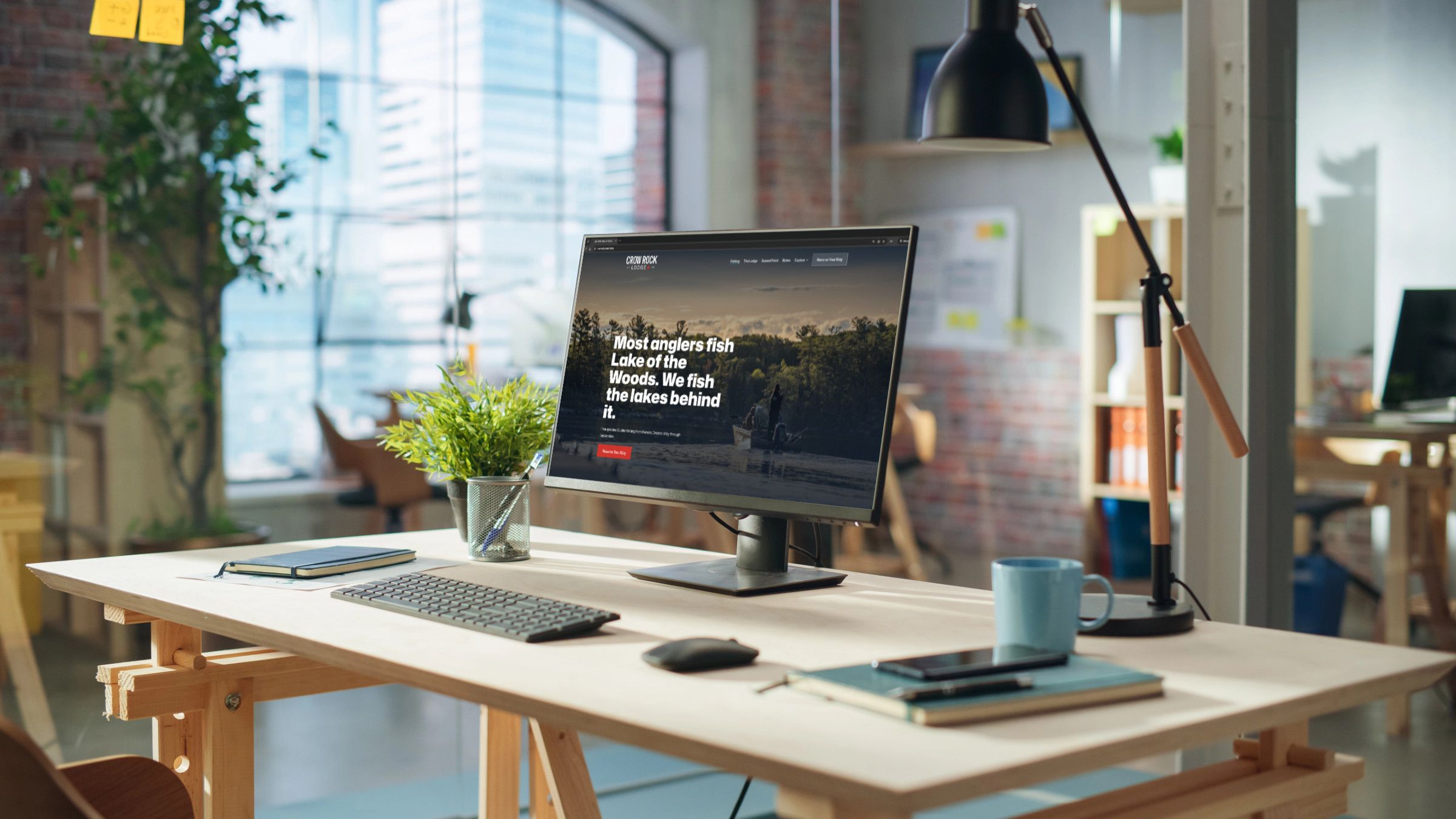 A custom website displayed on a desktop monitor in a modern office workspace, showcasing the professional design work that Dancing Pels builds for service businesses.
