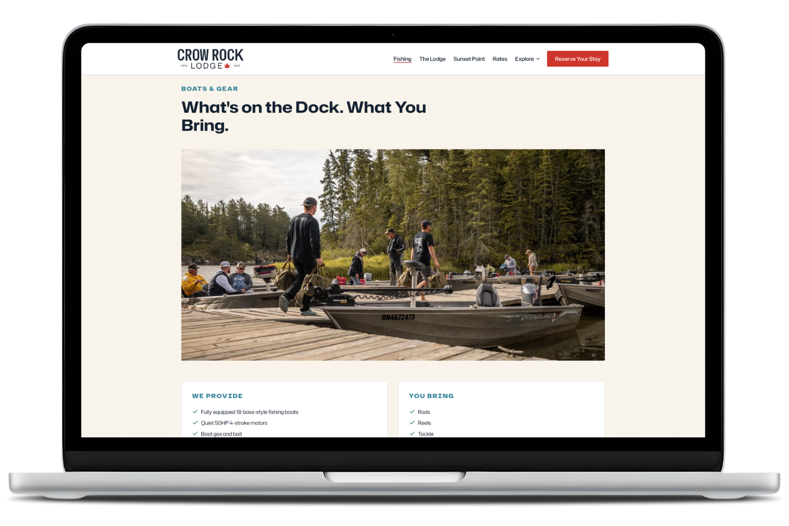 Crow Rock Lodge website displayed on a laptop, showing a fishing lodge booking page with boat dock imagery and service details.