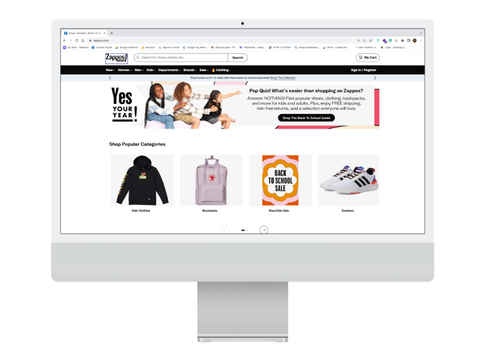 Zappos e-commerce homepage featuring back-to-school products, categories, and promotional banner—an example of custom website design and user experience.