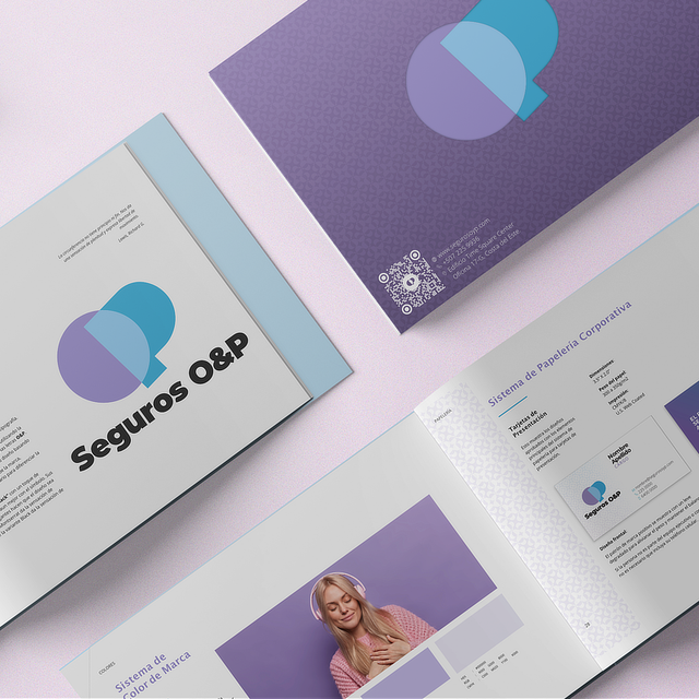 A cohesive brand design system featuring purple and blue overlapping circles, displayed across multiple marketing collateral pieces including folders and documents.