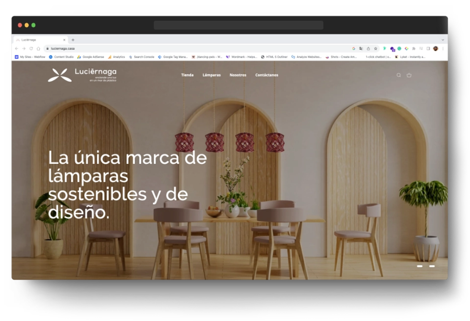 Luciernaga website homepage displaying a minimalist interior design with wooden furniture and hanging lamps, showcasing custom web design for a sustainable lamp brand.