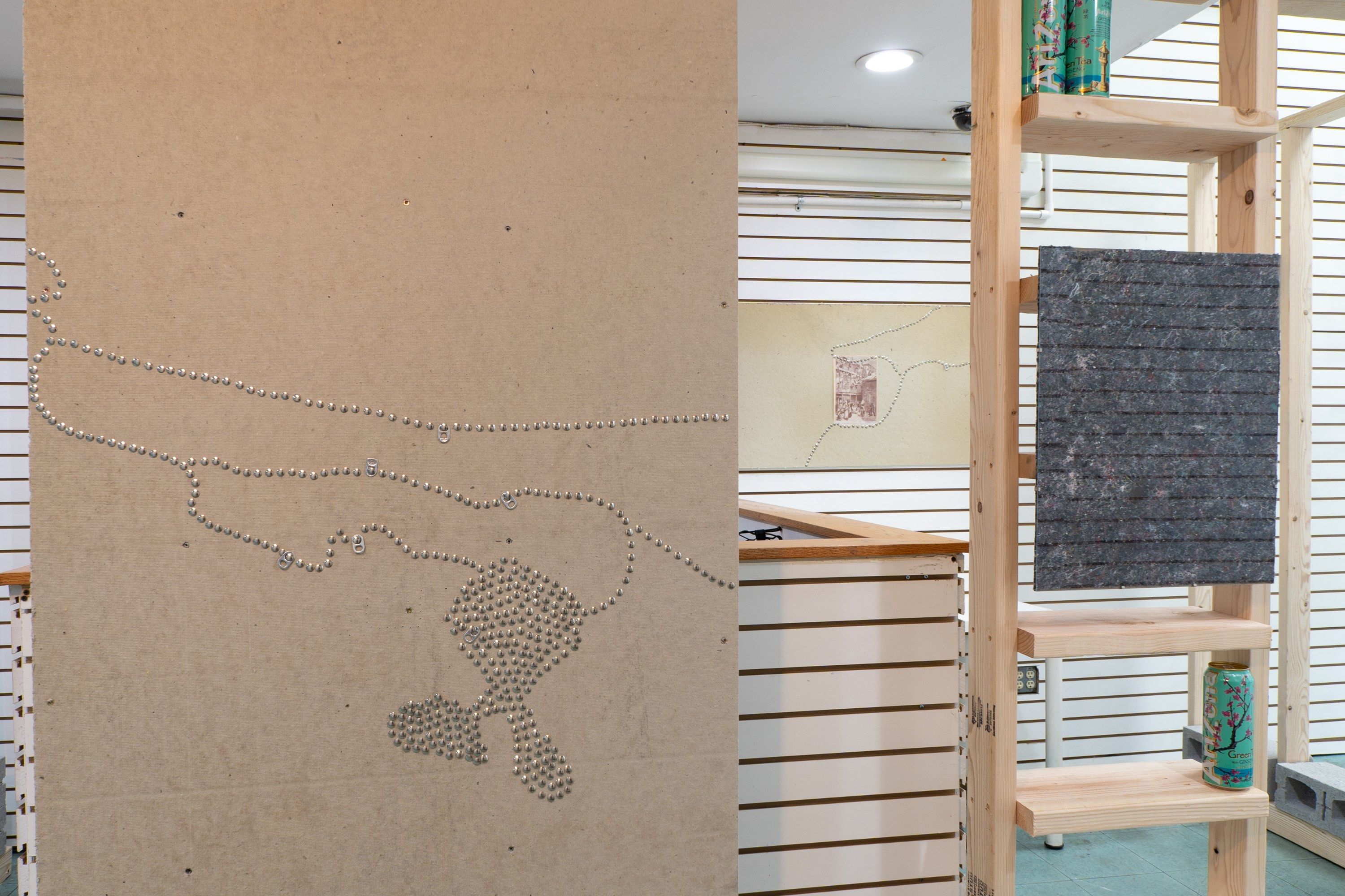 Detail of Notes Towards a Proposal for Ragpickers Court, including framed shoddy and aluminum beverage can . Photo by Sidian Liu. Courtesy the artist.