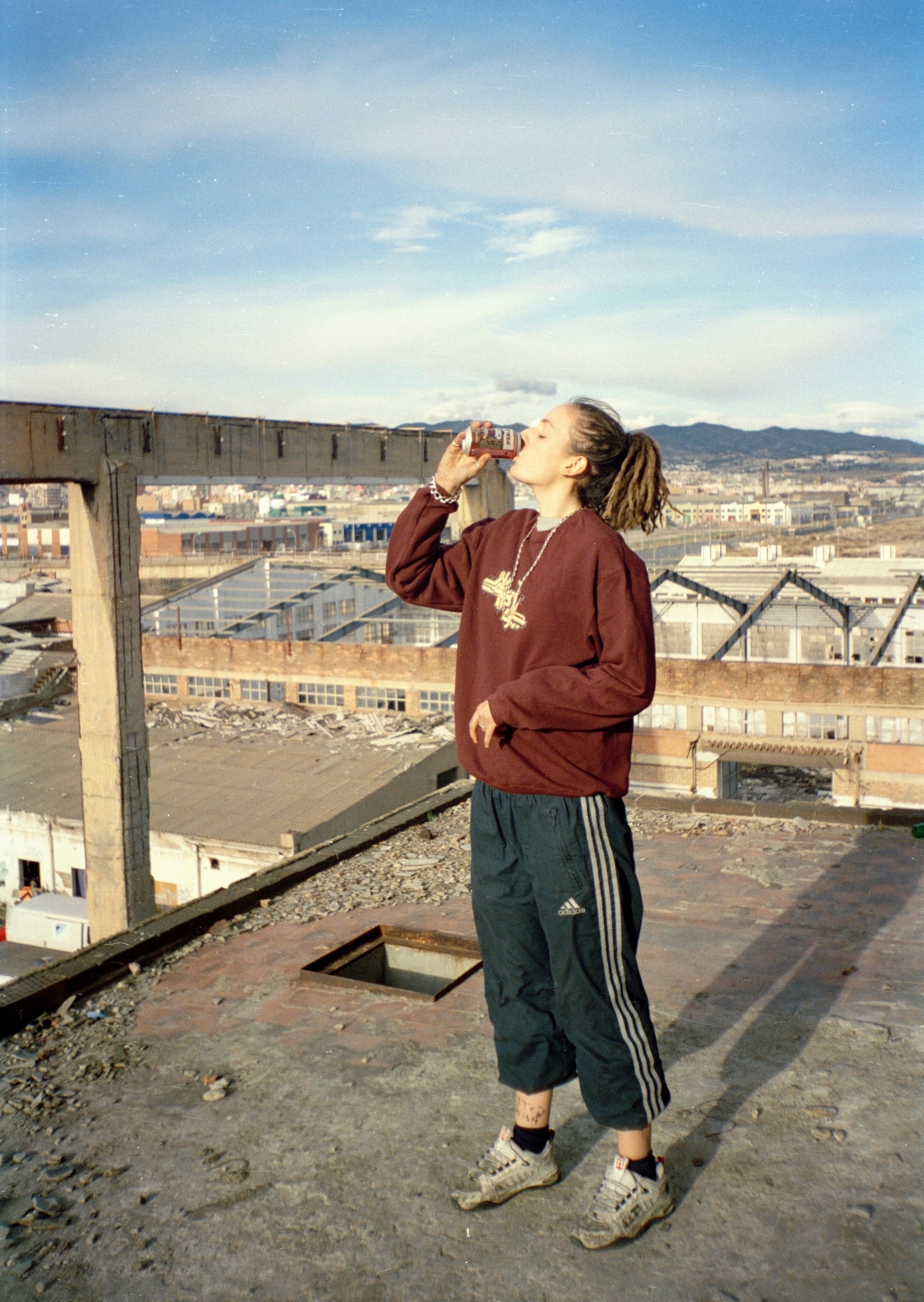 Alex on a rooftop, New Years Day in Badalona, Spain 2001. Courtesy Seana Gavin.
