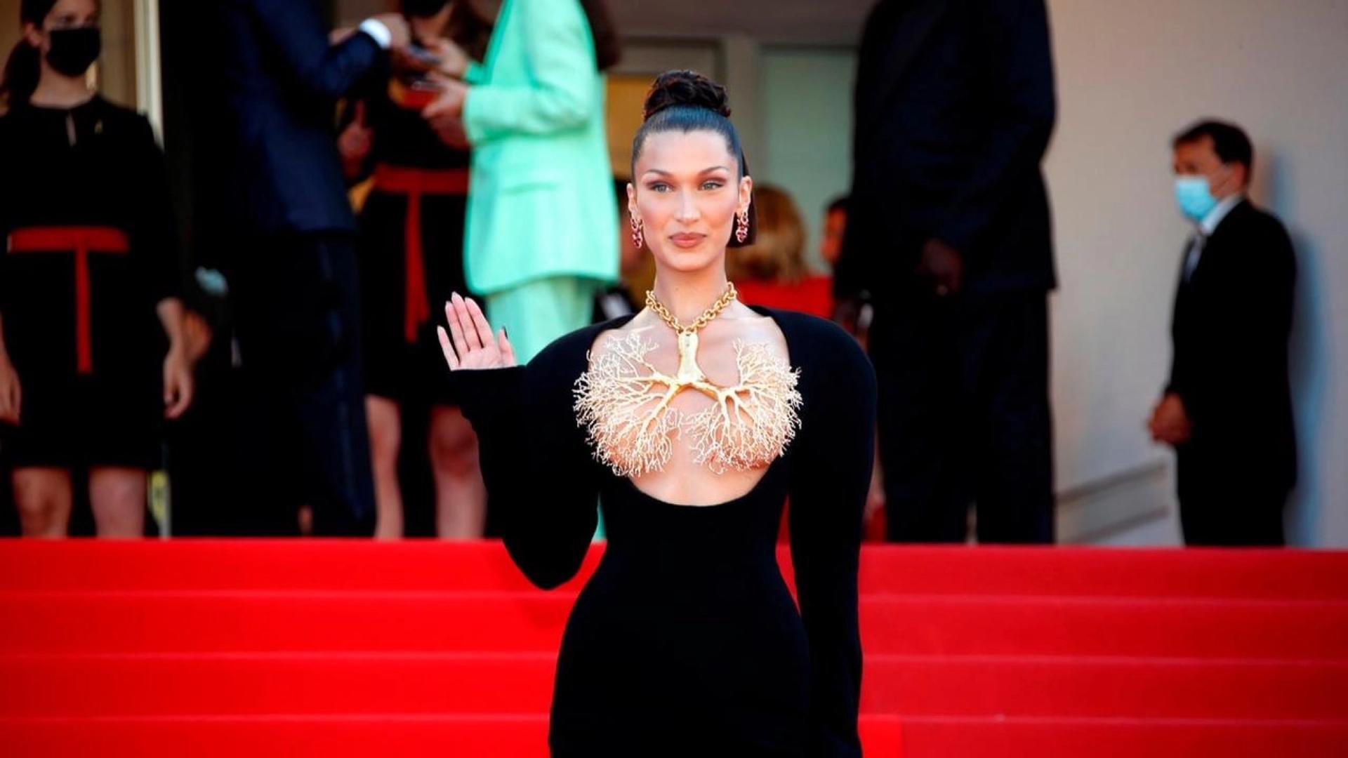 Bella Hadid wears Schiaparelli haute couture on the red carpet in Cannes, hours following the look's Paris runway debut.