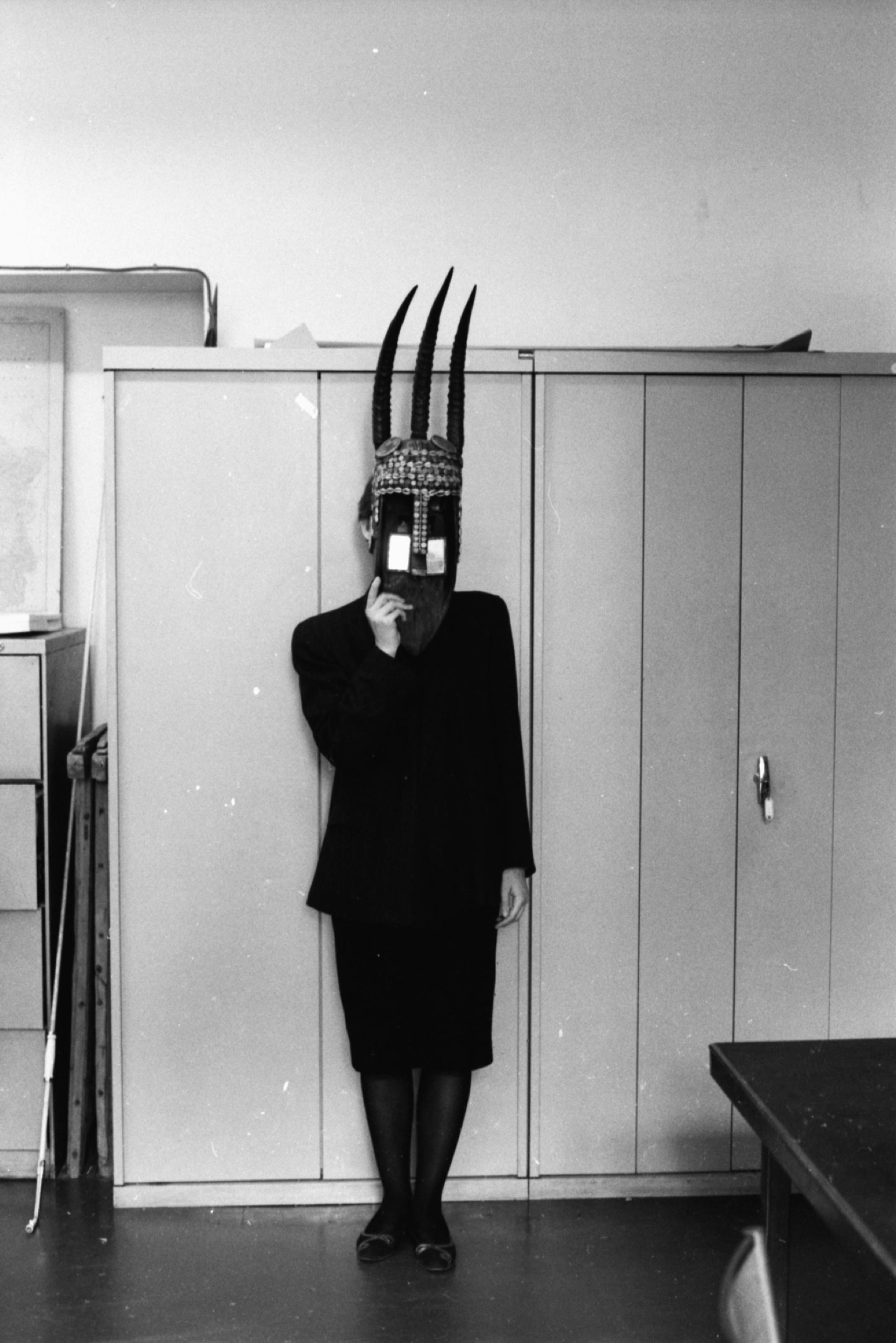 Clémentine Deliss wearing a mask in the office of Michel Leiris, Paris. Photograph Wolfgang Stengel