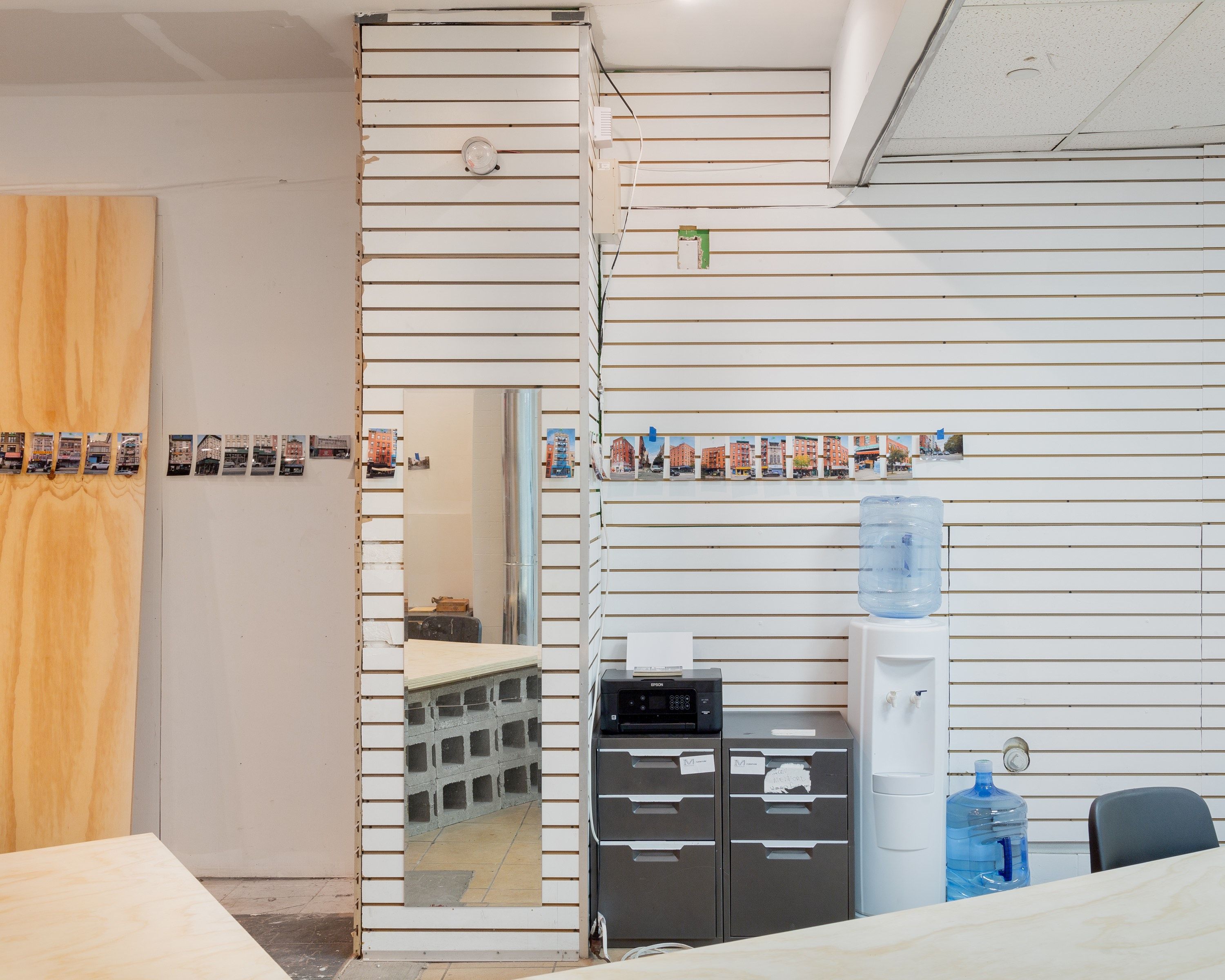 Canal Street Research Association’s first office at 327 Canal Street included a Timeline/Landscape of photos of every building on the block that ran around the perimeter of the room, and onto which visitors were invited to inscribe their notes directly onto the wall. Photo by Daniel Terna. Courtesy the artist.