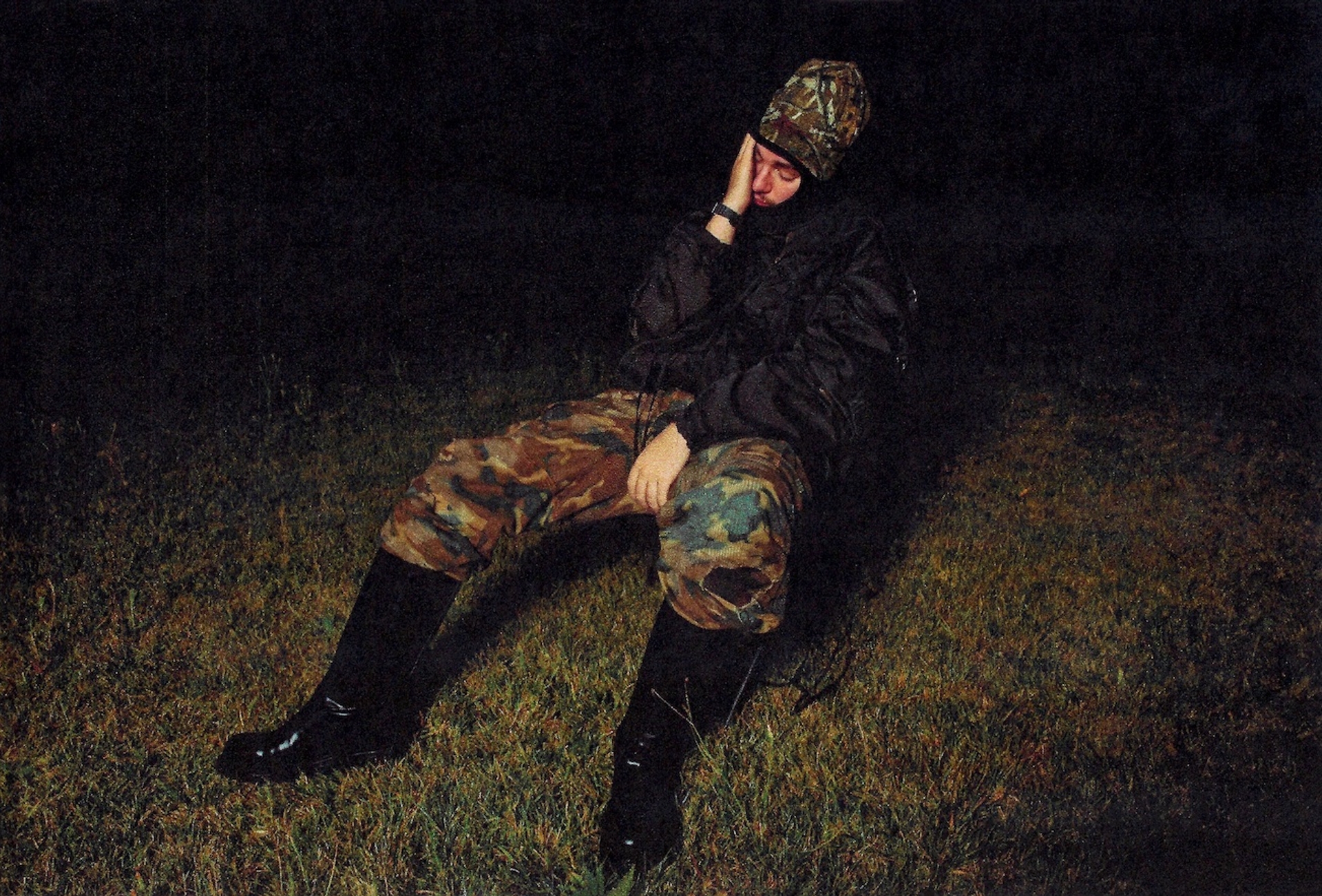hat DEADSTOCK MILITARY, ski mask UNBRANDED, top and jacket RAF SIMONS @DAVID CASAVANT ARCHIVE, pants GIVENCHY, shoes BOTTEGA VENETA, watch CARTIER