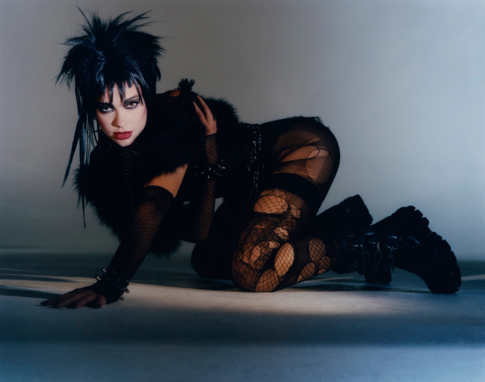 bodysuit SAINT LAURENT latex top HOUSE OF HARLOT gloves CORNELIA JAMES cuffs THE LONDON LEATHERMAN choker, necklace, and belt STYLIST'S OWN boots NEW ROCK tights FALKE