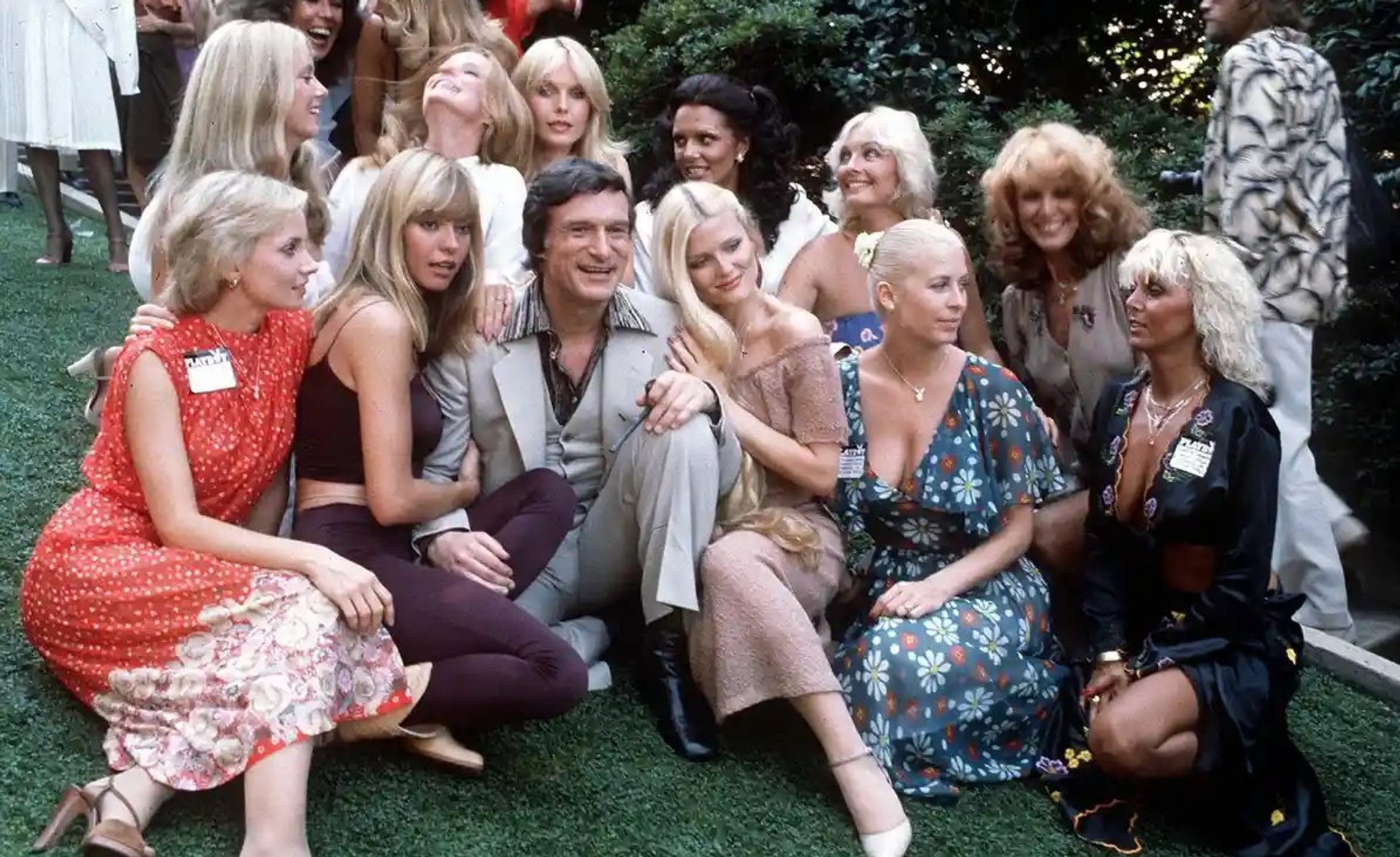 Hugh Hefner surrounded by Bunnies at Playboy Mansion, Los Angeles, CA., 1979 (Courtesy of Rex/Shutterstock)