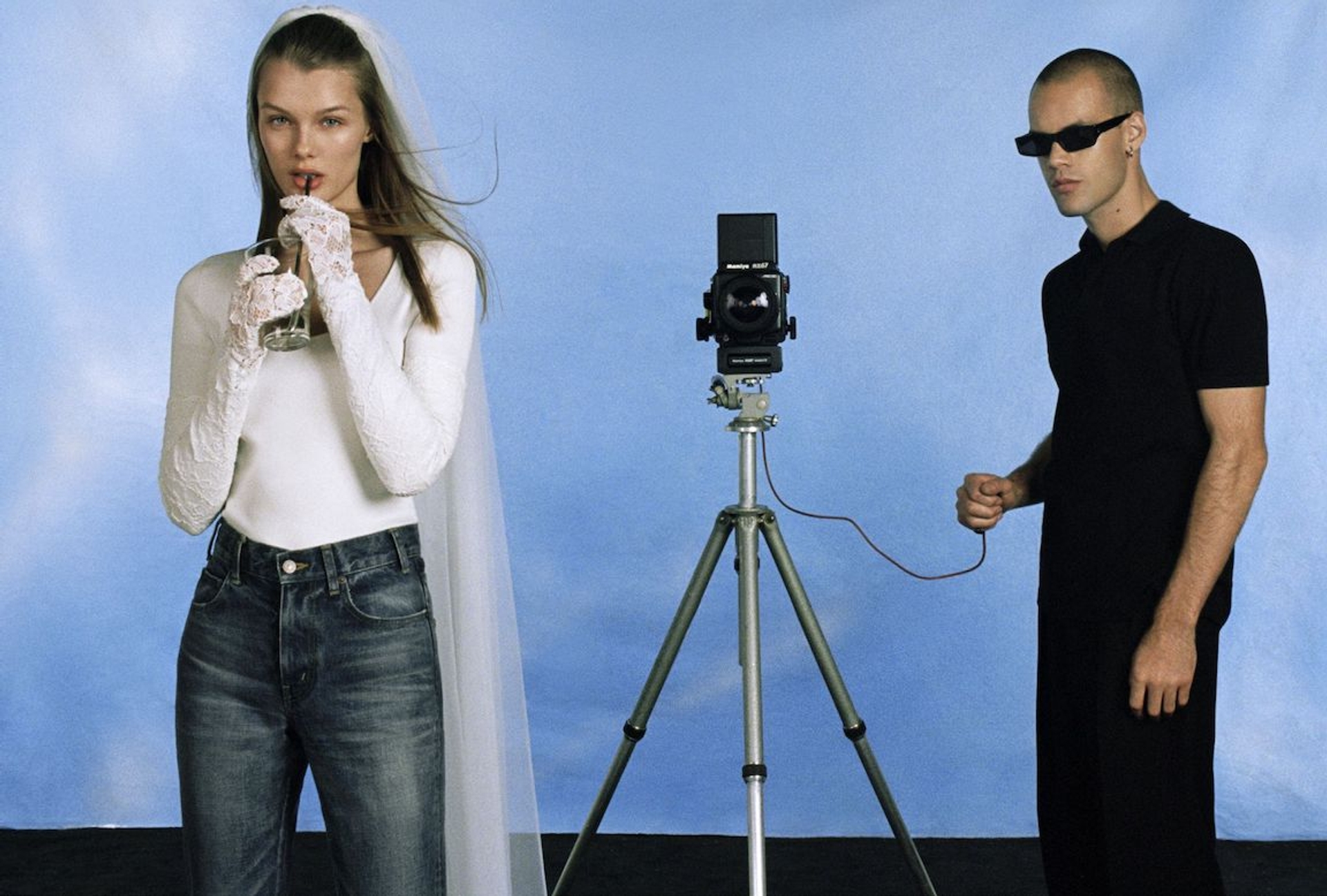 Kris wears a top by Balenciaga, denim by Celine, and a veil and gloves by Maison Margiela.