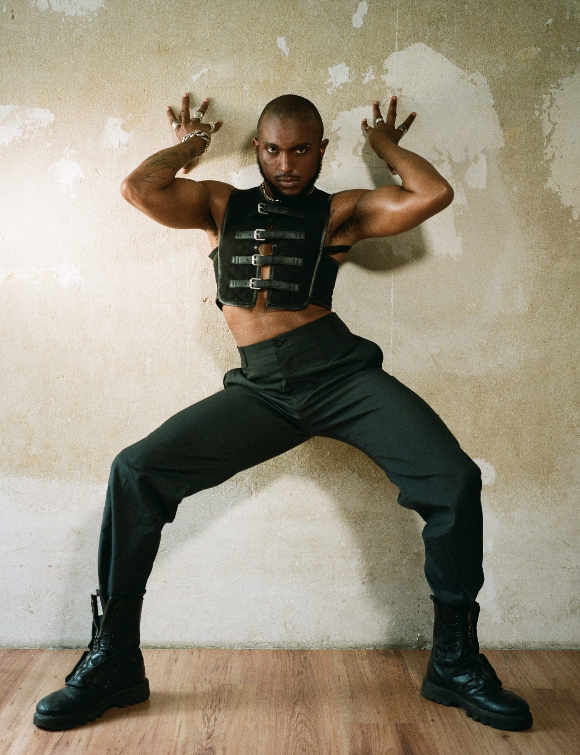 Vest GUCCI, pants BALENCIAGA, boots HELMUT LANG, jewelry NHAT-VU DANG