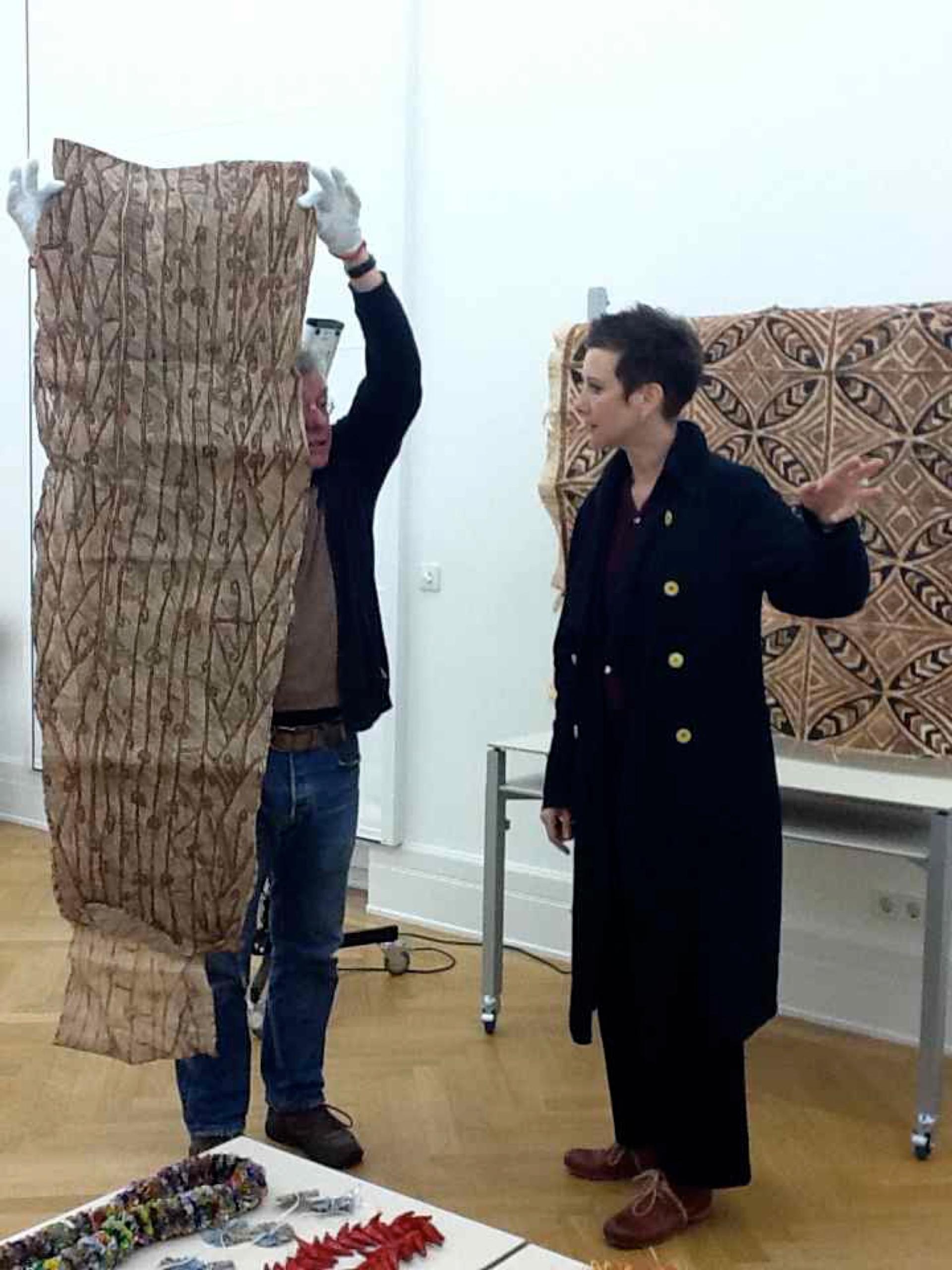 Clémentine Deliss installing Tapa cloth in the lab of the Weltkulturen Museum, 2012, photographer unknown.