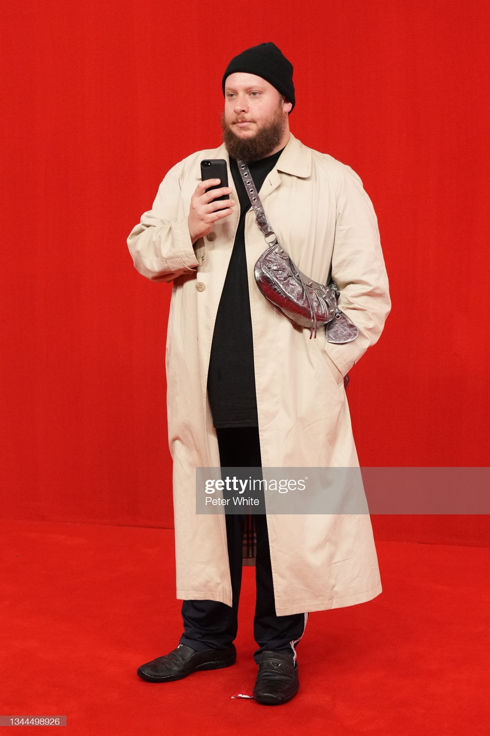 PARIS, FRANCE - OCTOBER 02: Guest poses on the runway during the Balenciaga Womenswear Spring/Summer 2022 show as part of Paris Fashion Week at Theatre Du Chatelet on October 02, 2021 in Paris, France. (Photo by Peter White/Getty Images)
