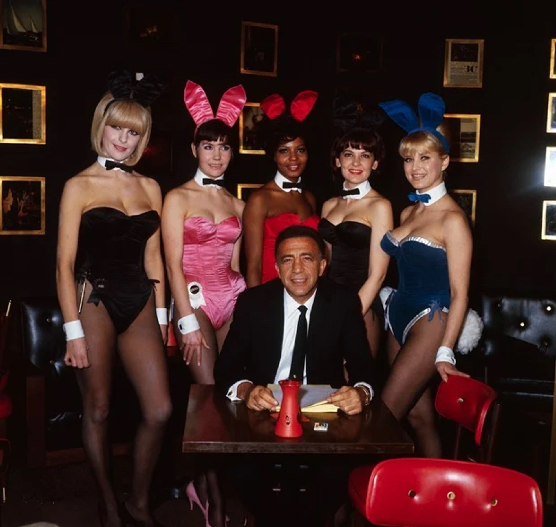 Photo of Bunnies (Left to right: Jodi, Erika, Cathy, Marilyn, and Marta) posing with Tony Roma, General Manager of New York Playboy Club (Courtesy of The New York Historical Society, Keystone Features, New York City)