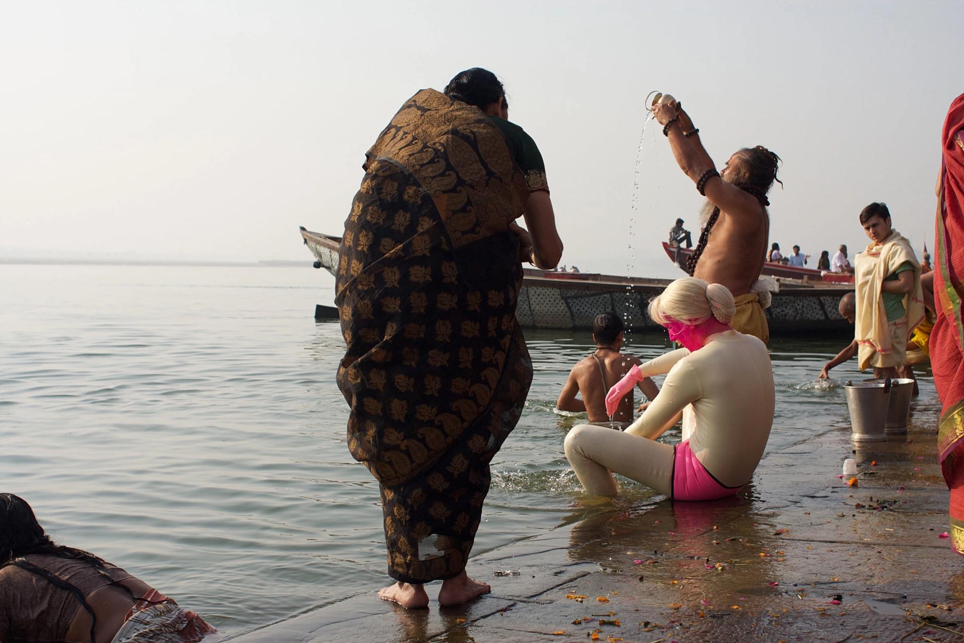 Transformella performs ablutions during her tech-fertility-oriented research trip to Varanasi.