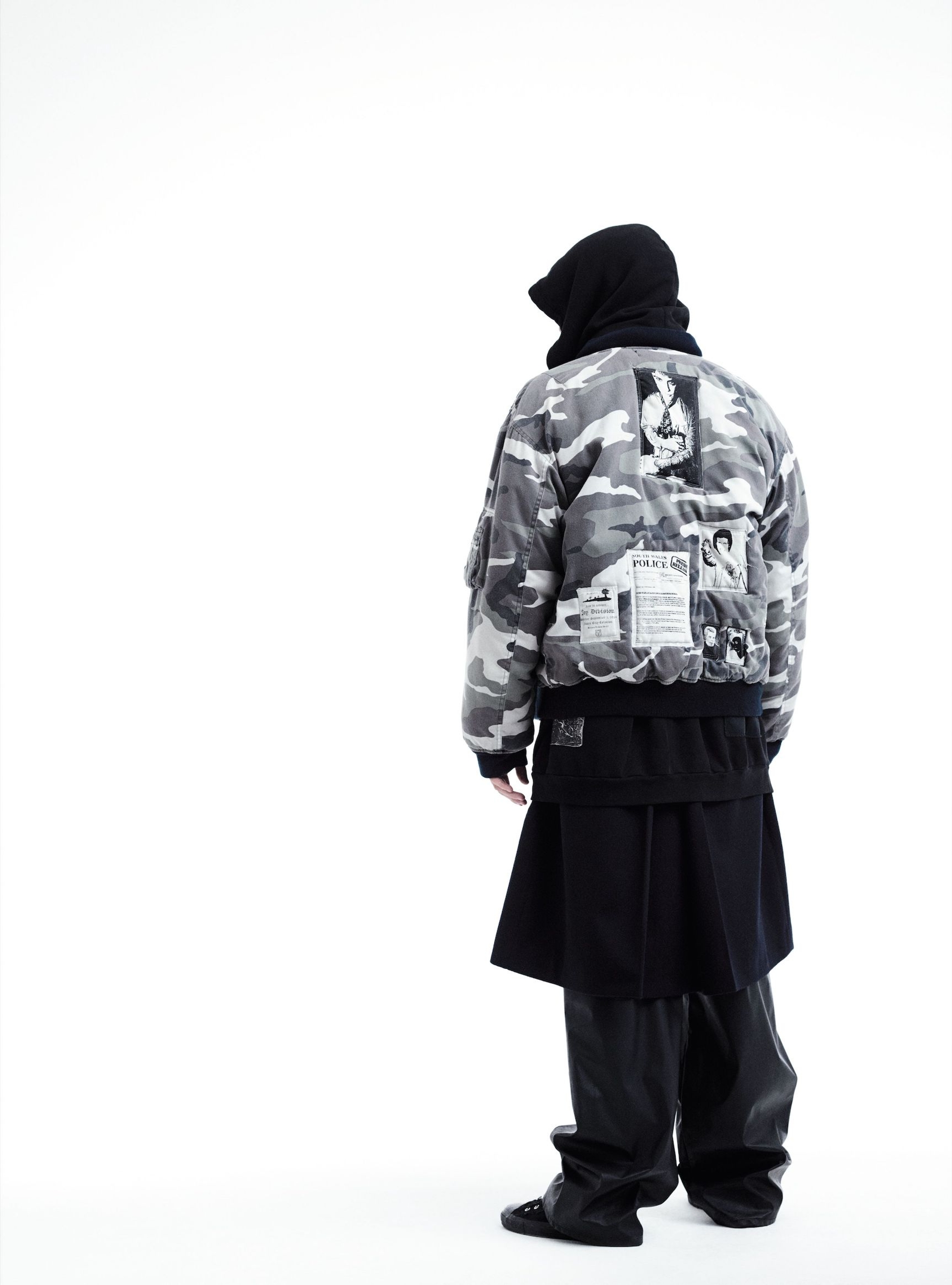 LUCA: cotton distressed camouflage patched bomber jacket, cotton distressed hooded patched sweat shirt, wool trench coat, rubberized jogging pants, customized 'All Stars': RAF SIMONS A/W 2001/2002