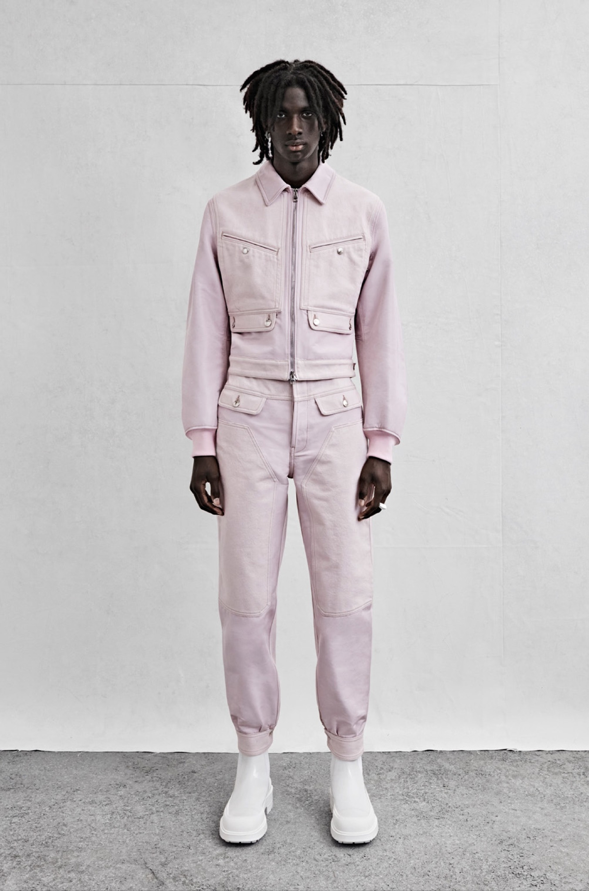 A patched bomber jacket and trousers in pale lilac denim and poly faille.
