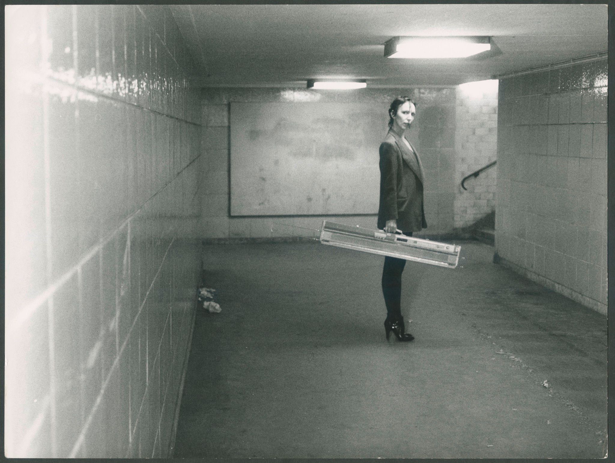Claudia Skoda with her knitting machine in the U-Bahnhof station at Kottbusser Tor, Berlin, ca. 1976-77. Photo: Martin Kippenberger