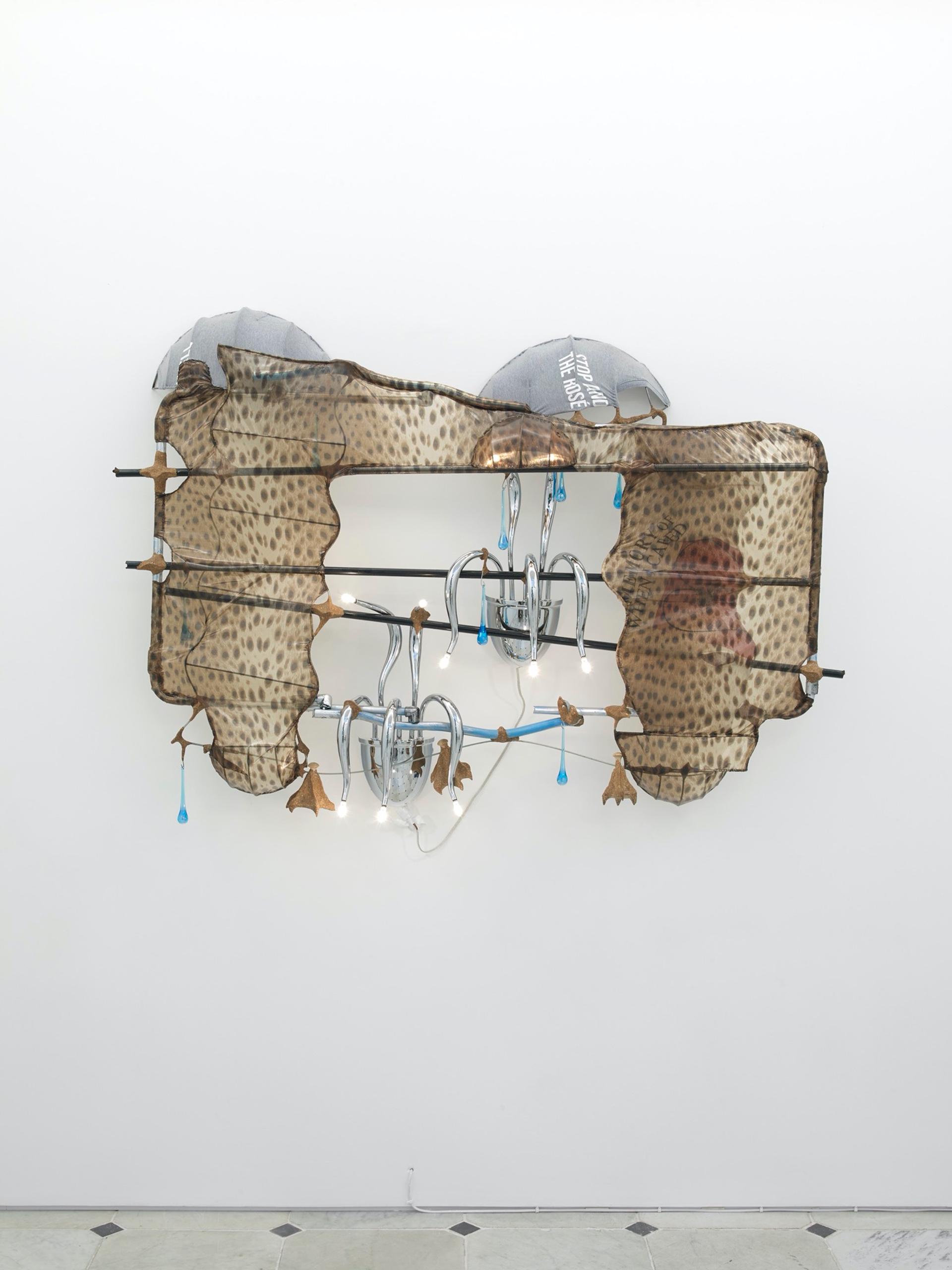 Jessi Reaves, Mantlepiece Sconce, 2019. Metal, glass, fabric, sawdust & wood glue, lamp wiring & bulbs. 41 × 58 × 12 in. (104.14 × 147.32 × 30.48 cm) Courtesy the artist, Herald St, London and Bridget Donahue NYC. Photo: Andy Keate.