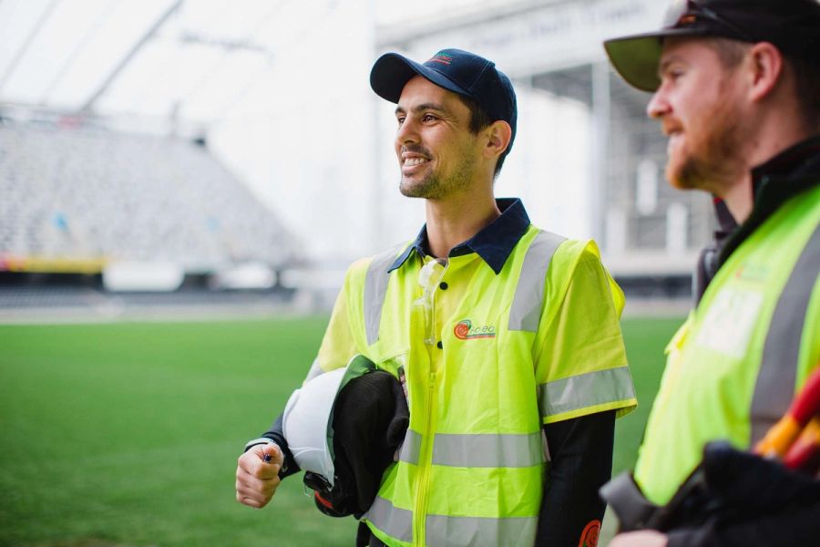 Aotea tradespeople wearing high-visibility workwear at a stadium project