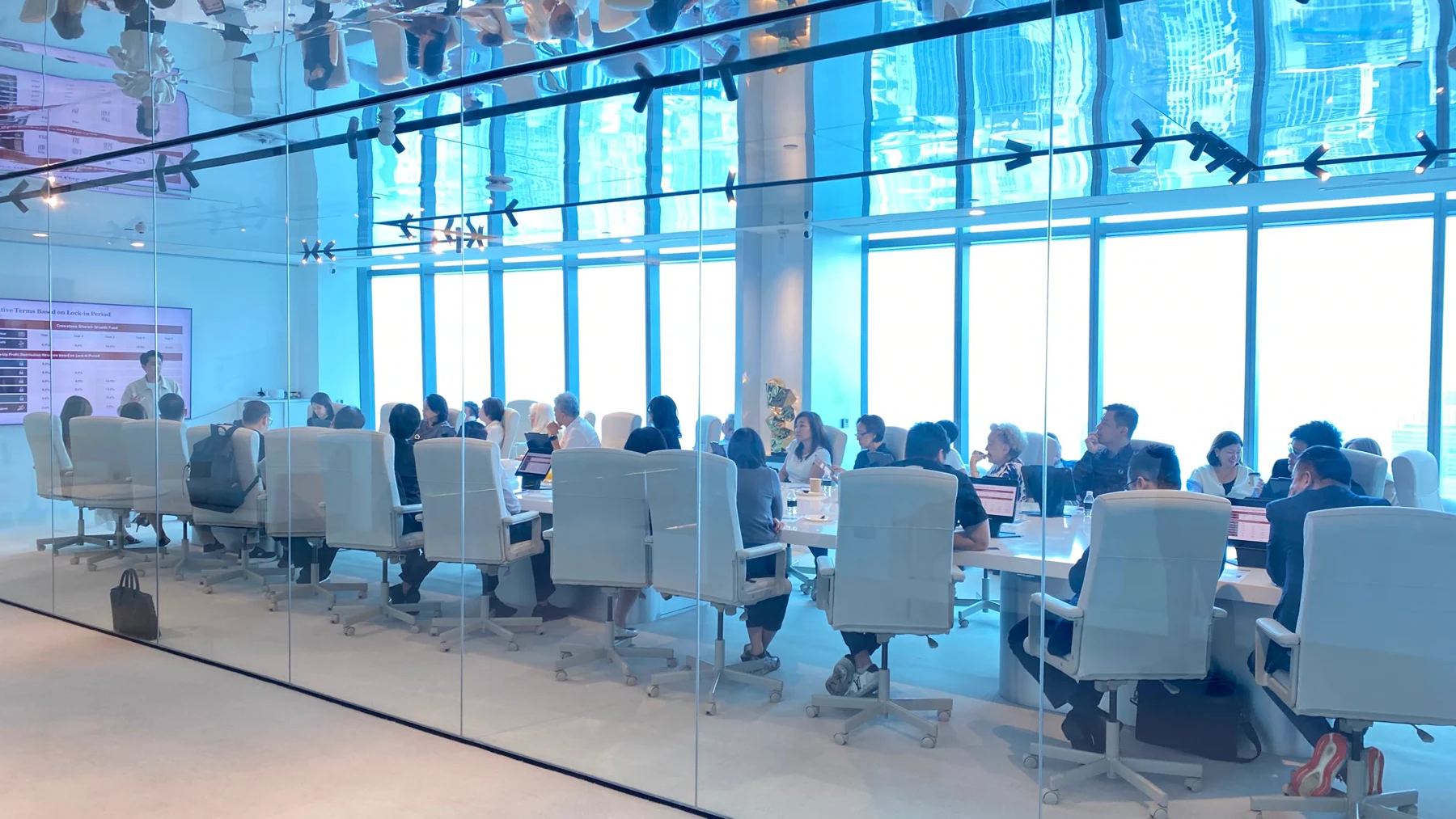 Crewstone representatives meeting with investors and partners around a conference table