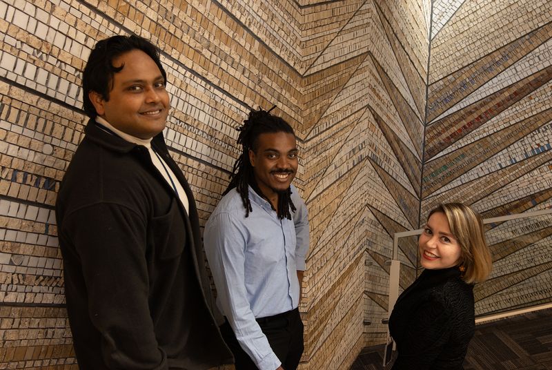 Members of the Genomines team standing together at the office