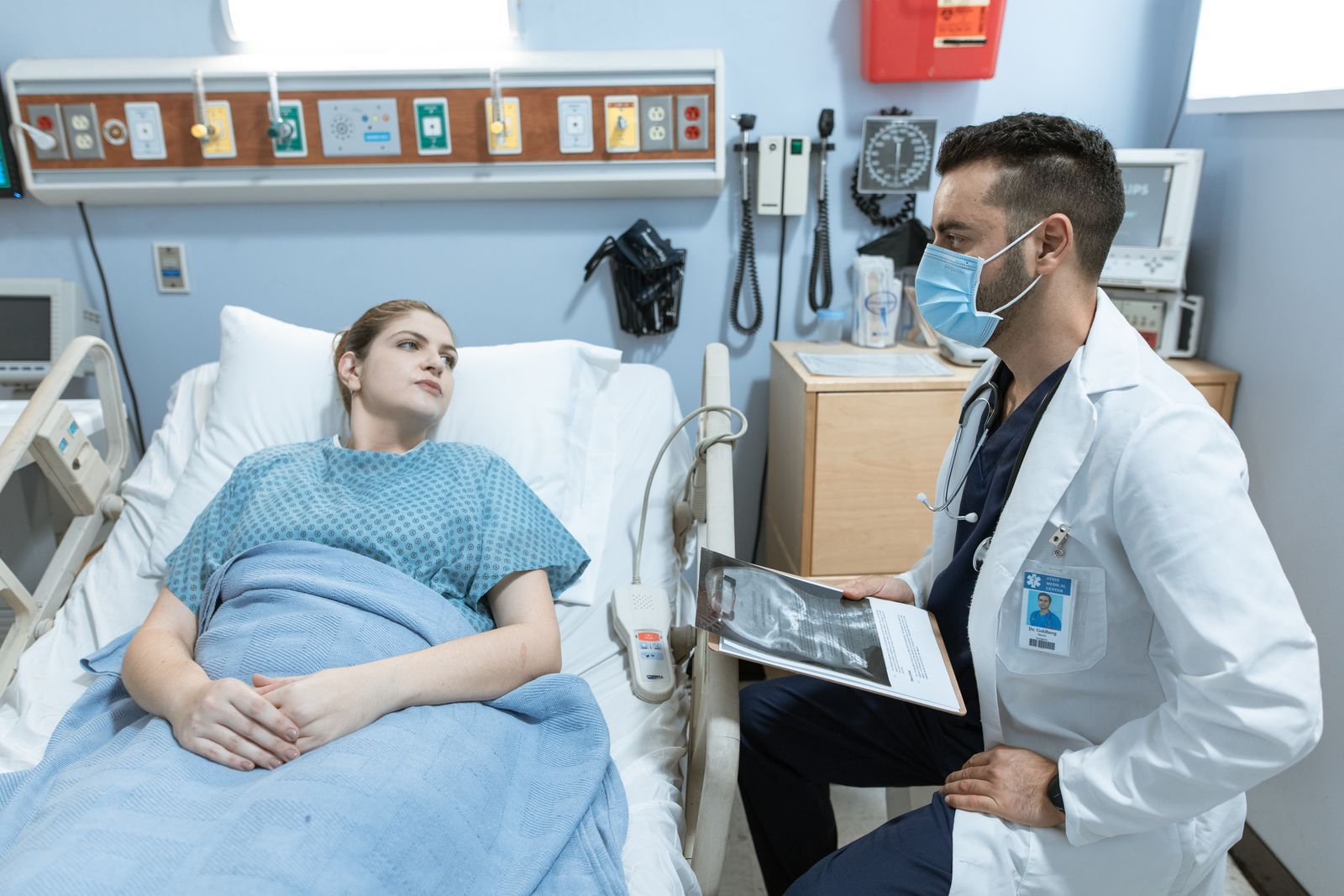 A clinician communicating with a patient