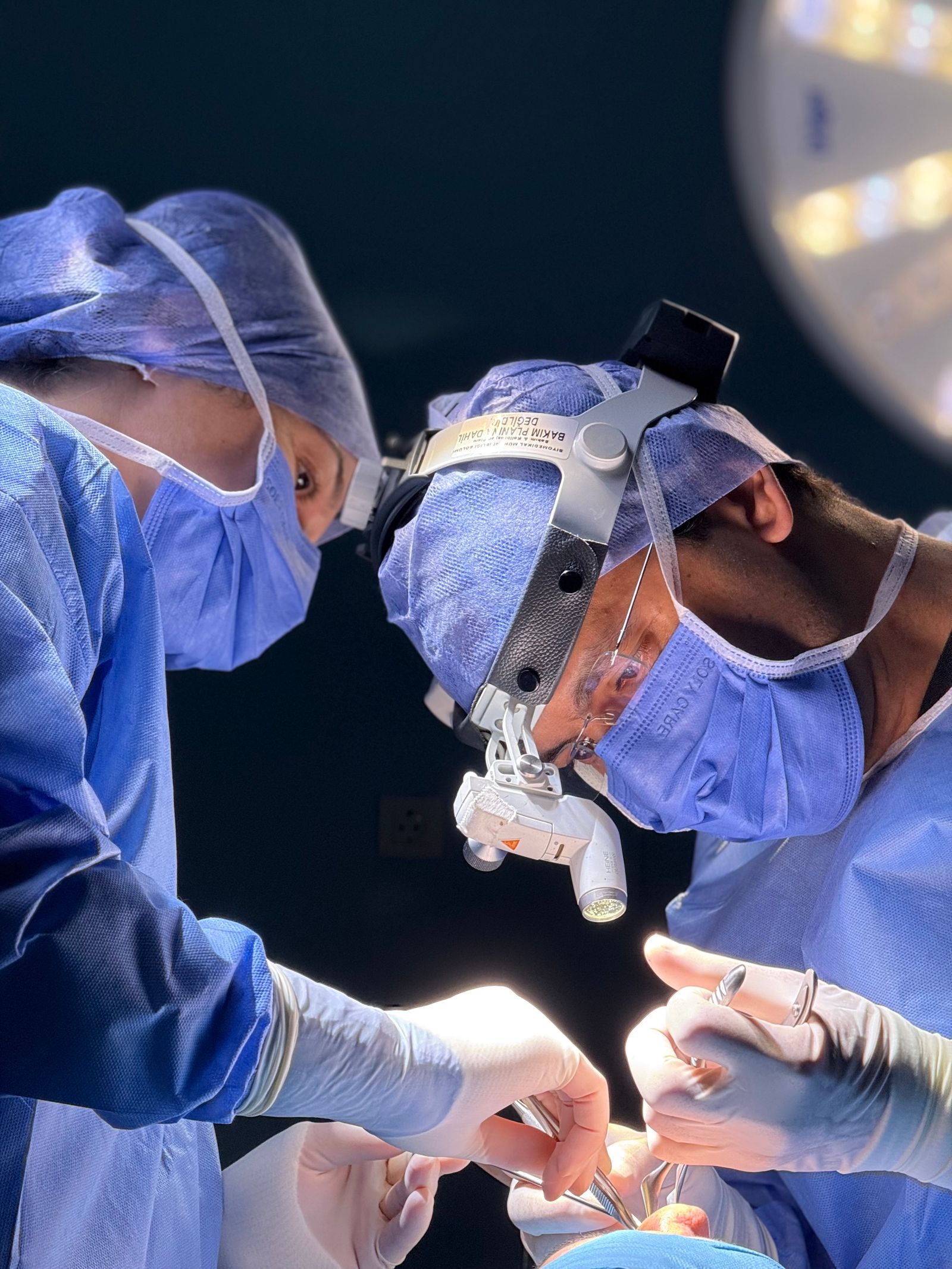 Two surgeons working together with precision during an operation