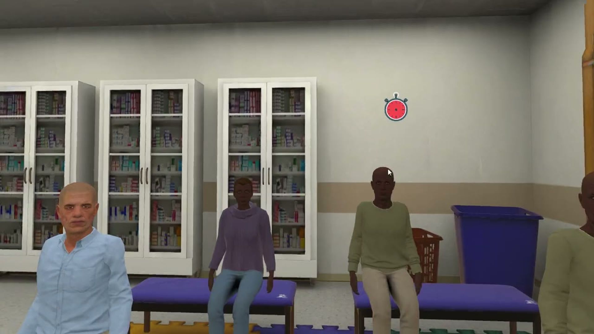 Virtual residents seated in the gym of the long-term care simulation, with the medication cabinets behind them