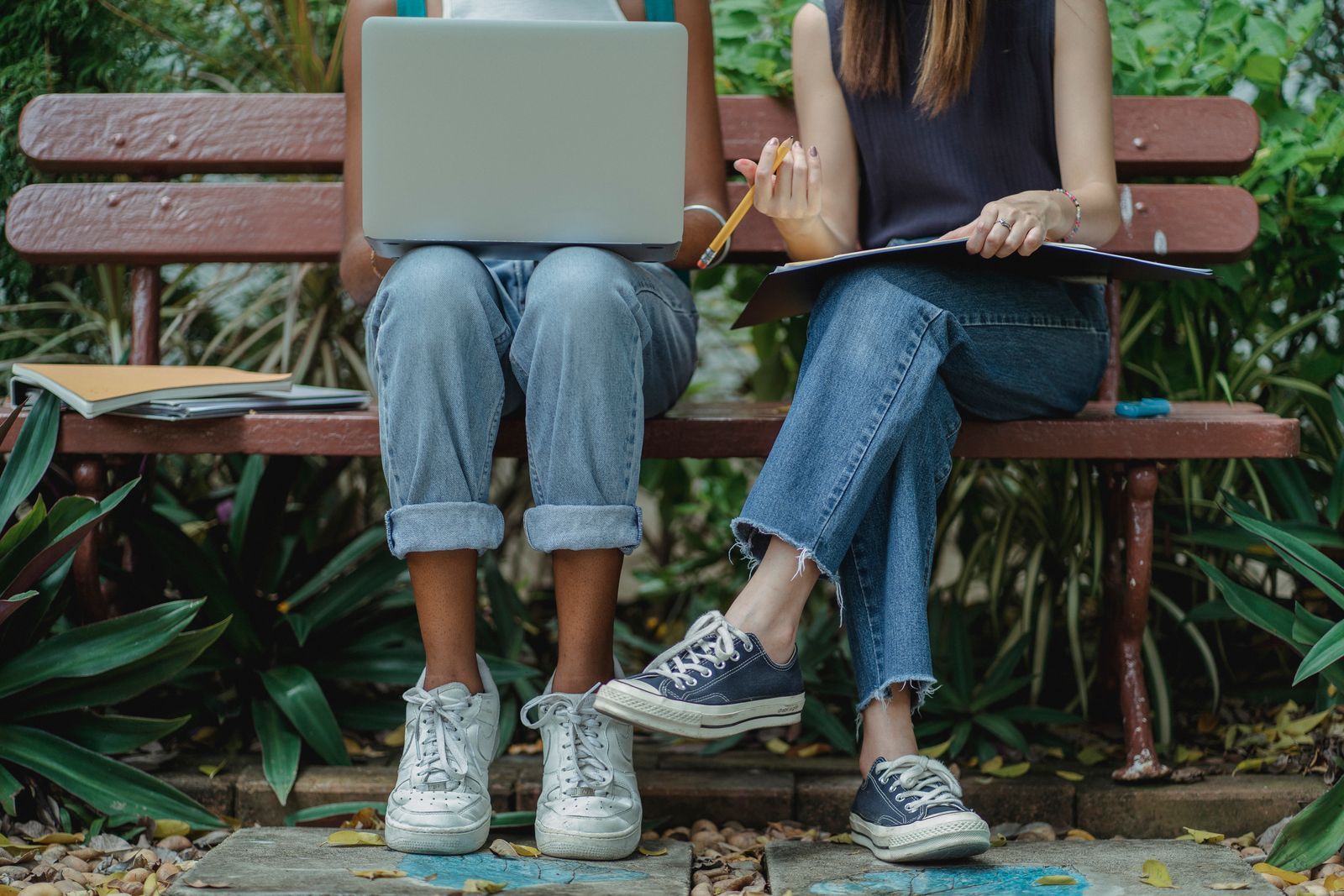 Two students sharing a laptop while studying together