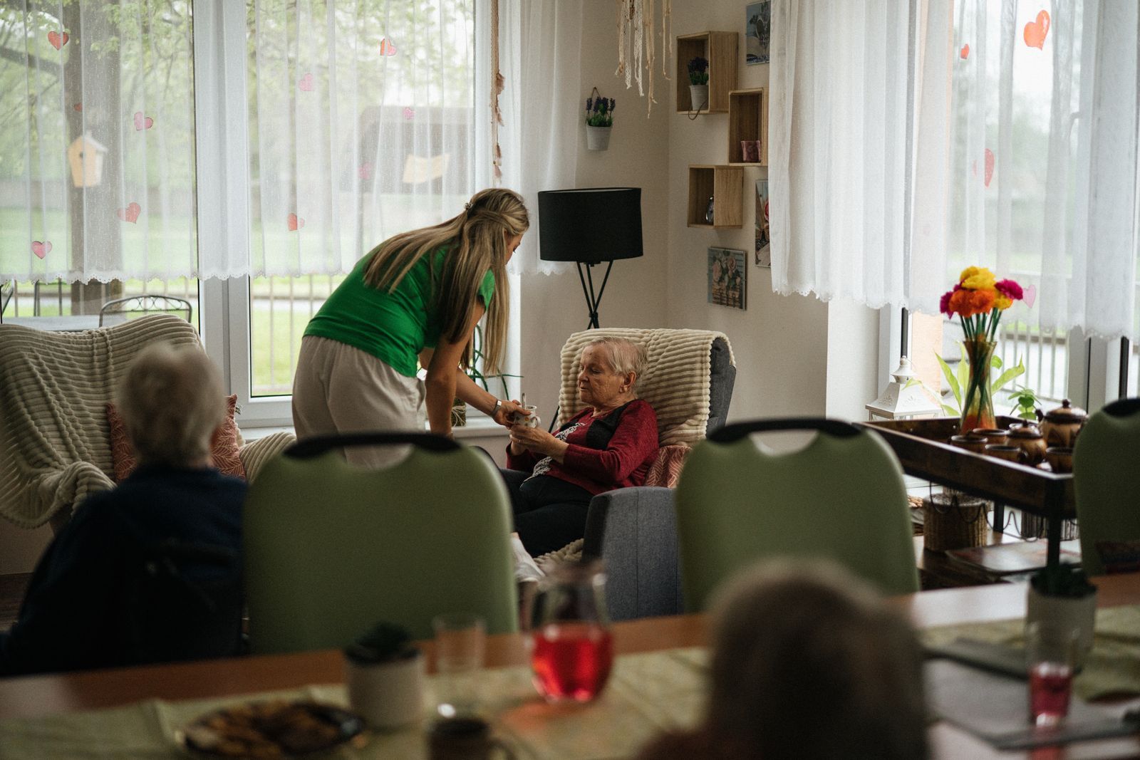A nursing or physiotherapy student talking with a patient