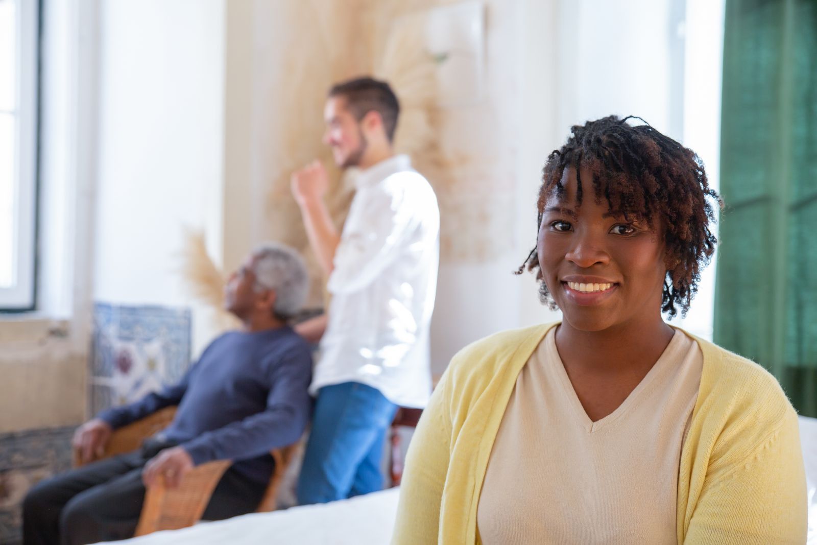 A caregiver and an older adult in a long-term care setting