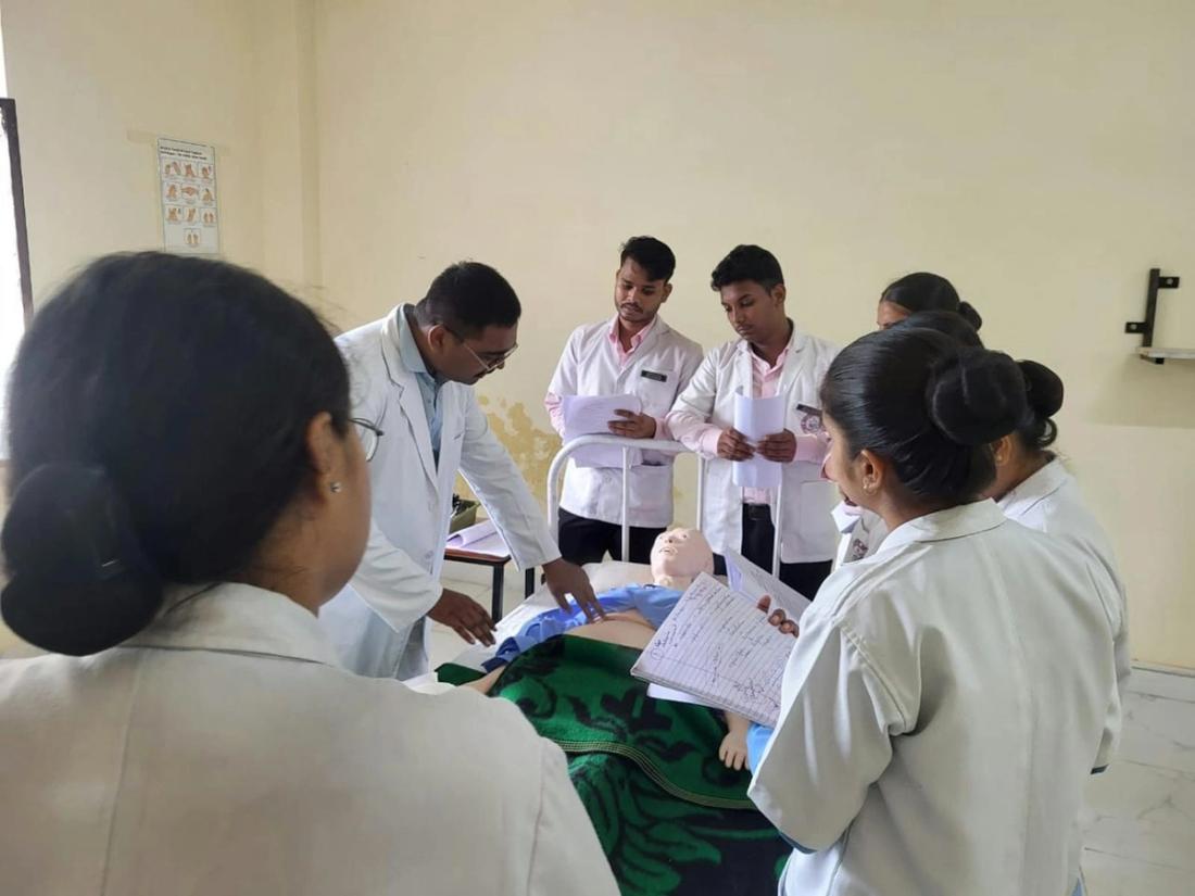 Health-care students following a training session in a classroom