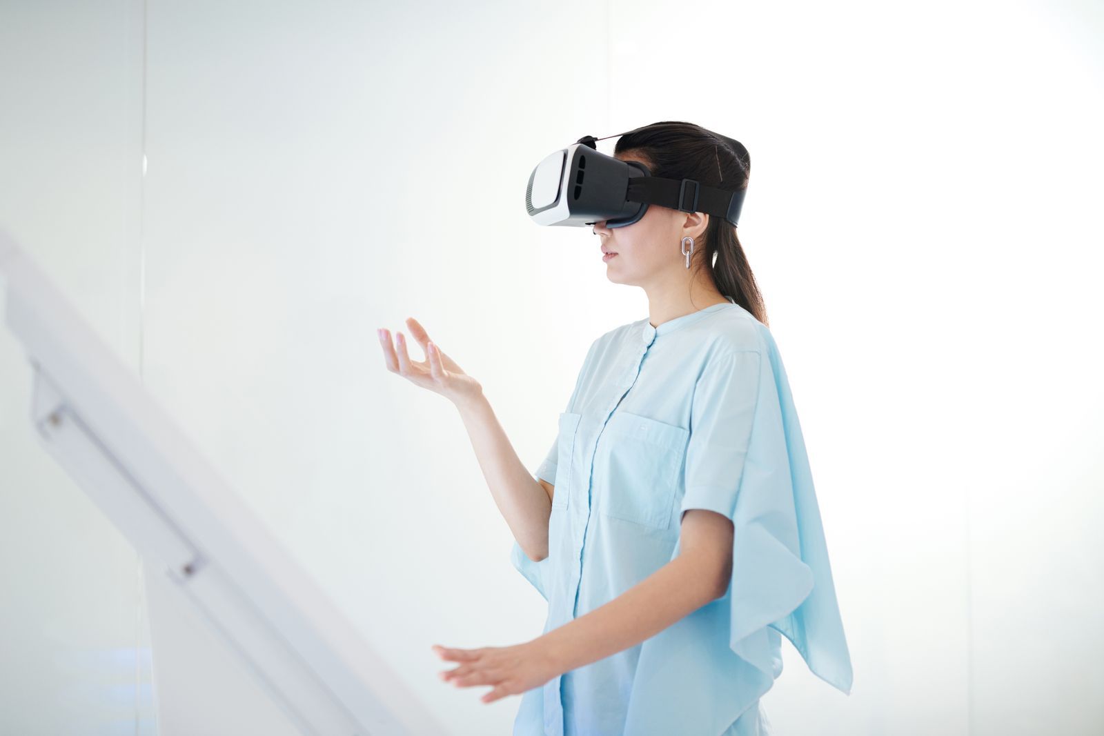 A young woman using a virtual reality headset