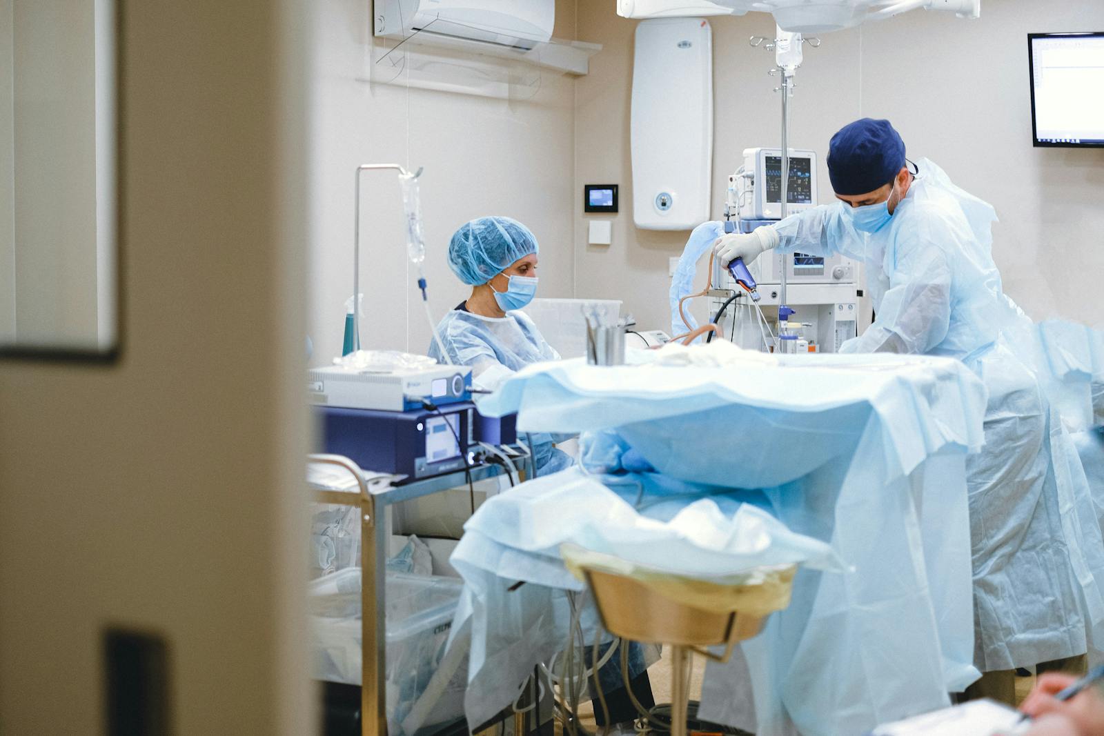 A surgical team in scrubs working together during a procedure in an operating room