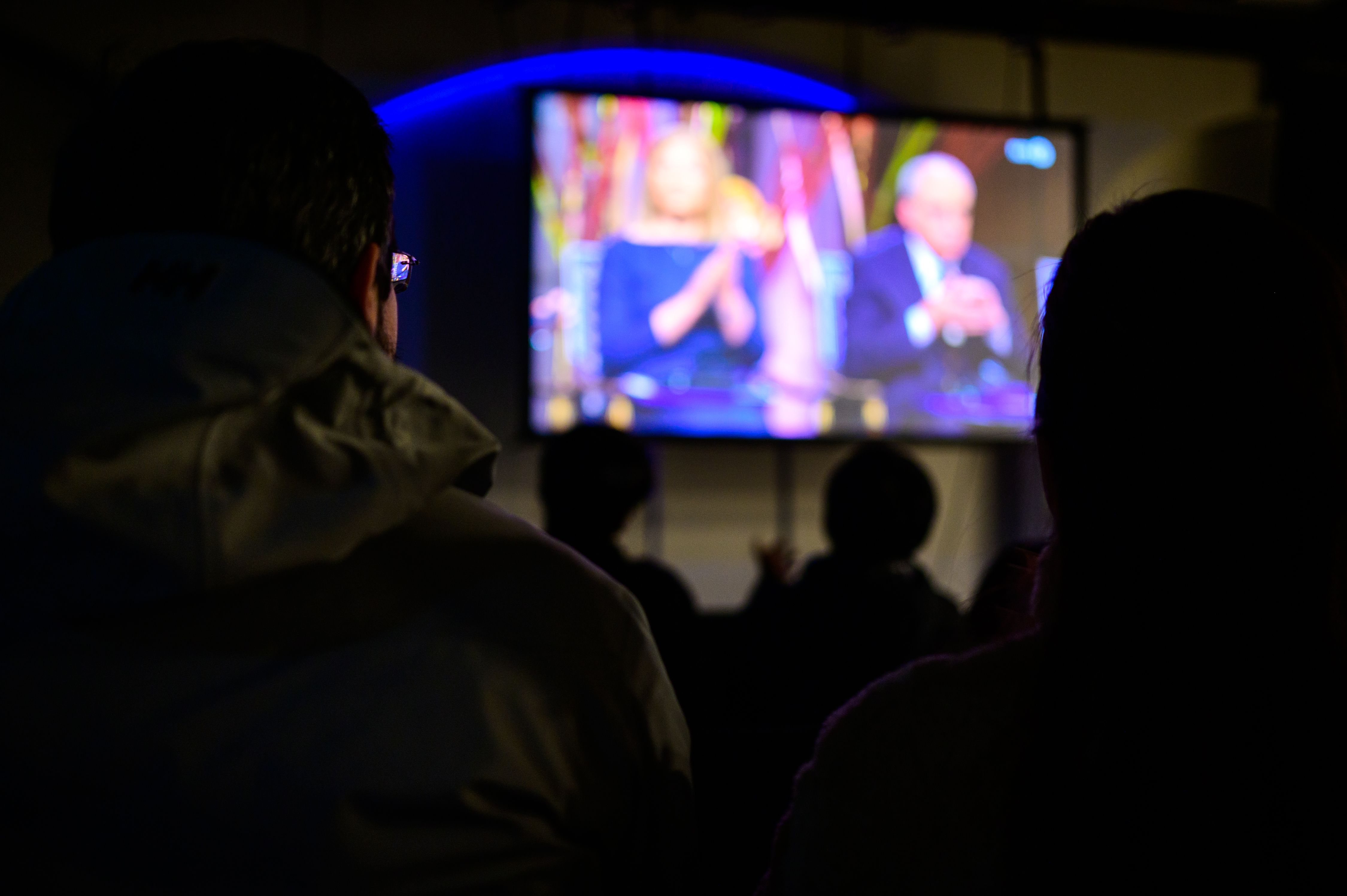 People gathered watching the nobel peace prize ceremony.