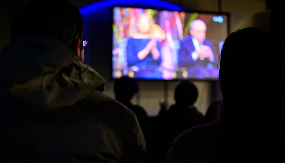 People gathered watching the nobel peace prize ceremony.