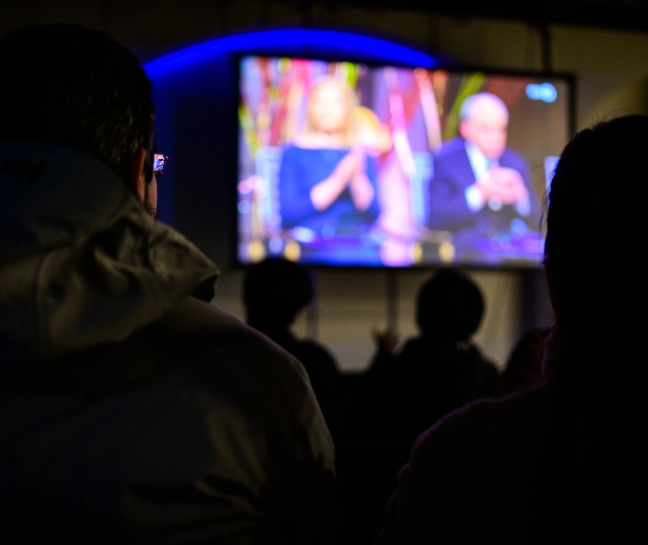 People gathered watching the nobel peace prize ceremony.