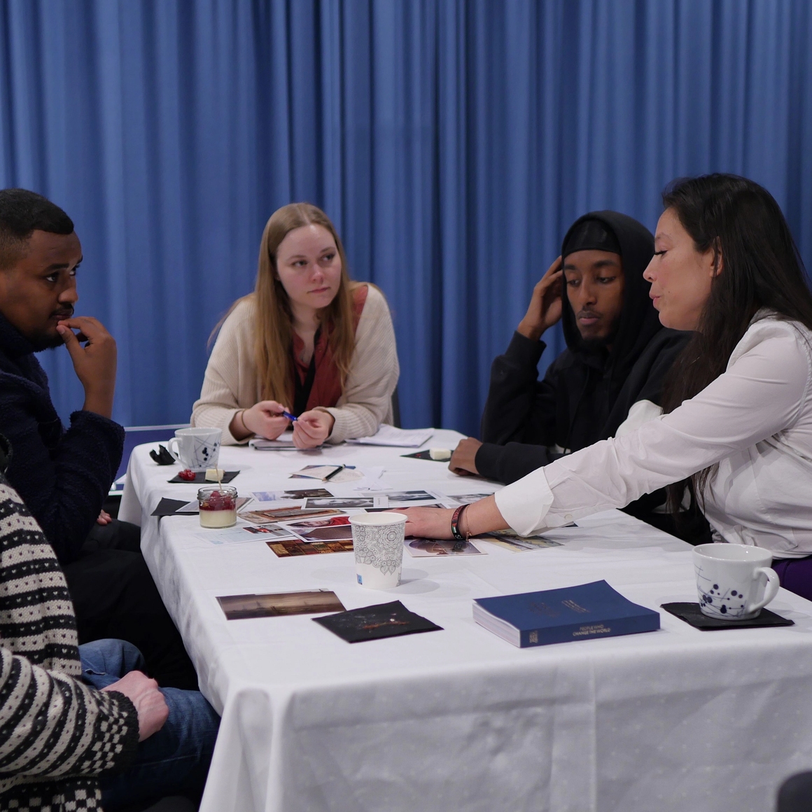 the group gathered to talk about their collage and choices.
