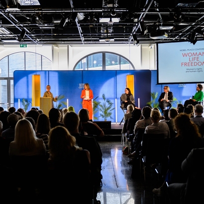 from stage, speakers and audience.